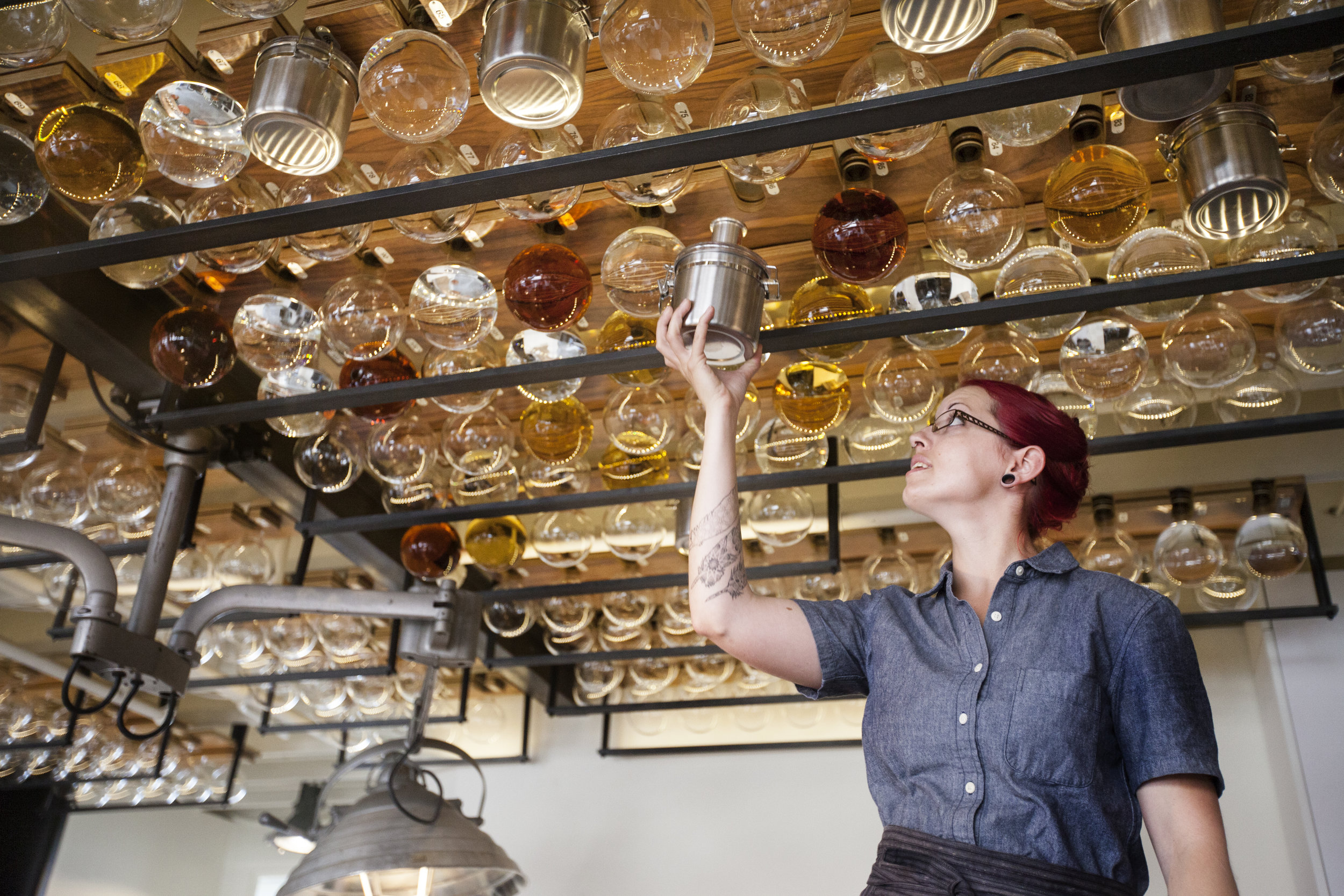  The hanging bottles catch the light of the LEDs we've suspended from the ceiling. Specially-designed hangers for earthquake country securely hold this laboratory flask glassware in place. 