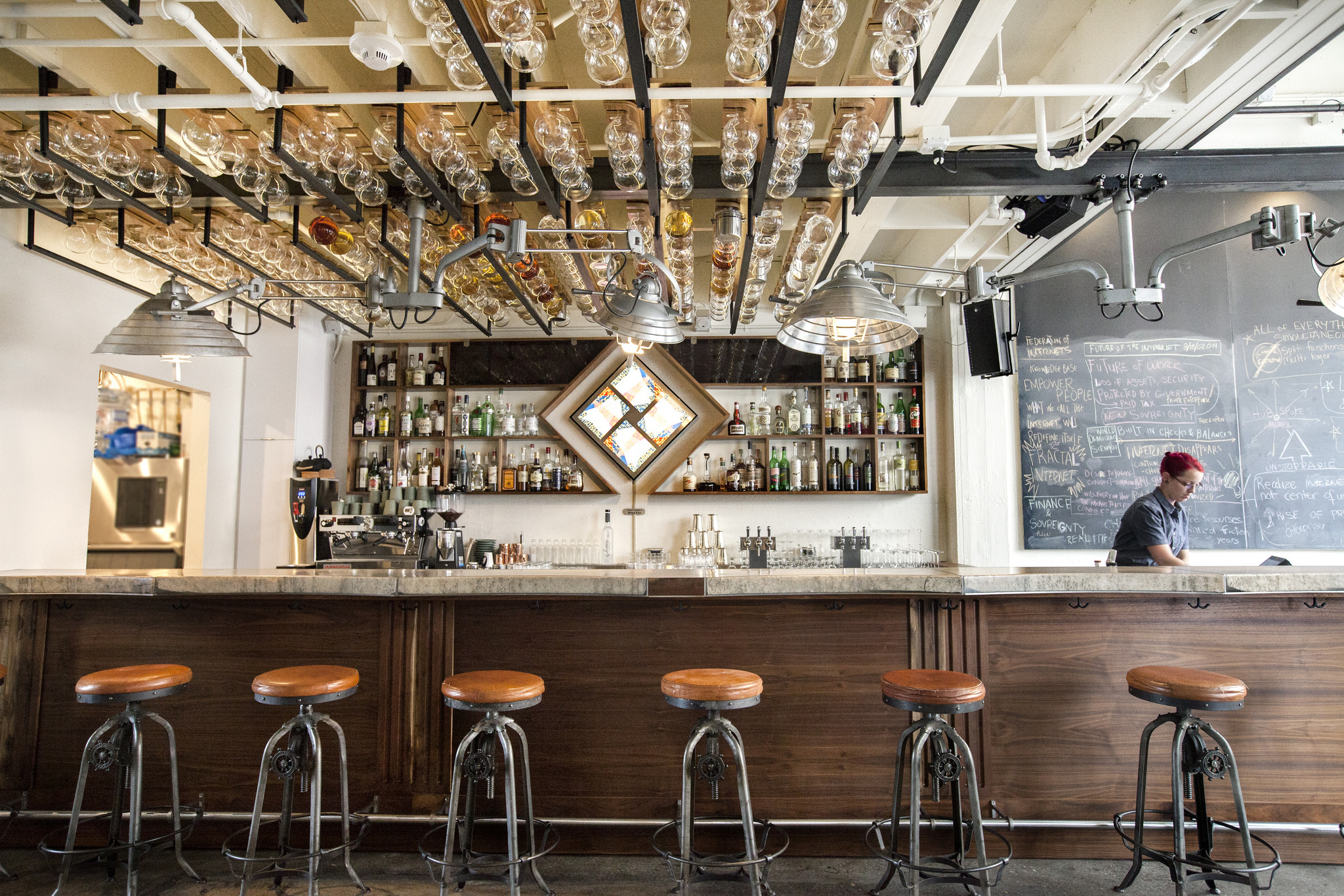  &nbsp;When The Longnow came to us with the desire to redesign their space, we jumped at the opportunity. In the 1930’s, it was a blacksmith shop. Now, it is a cafe in the daytime that transforms into a bar &amp; oratory venue at night. We've designe
