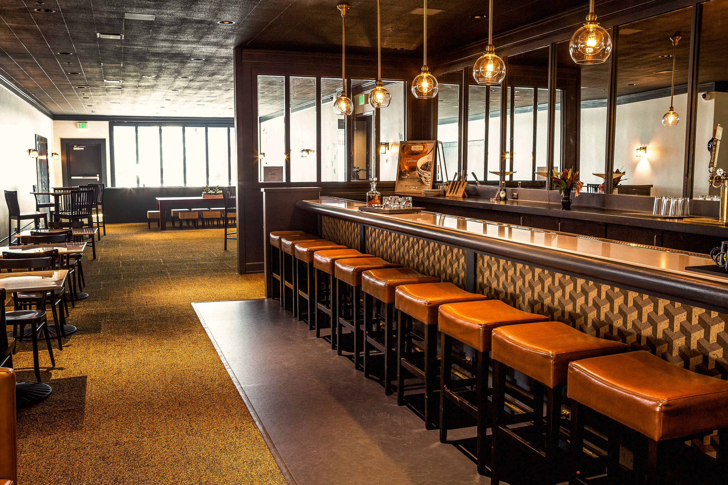  The once bar of the upstairs restaurant has been re clad and painted. New carpeting and fixtures have been added to this area, so we were able to re-use the existing infestructure and turn this into a now communal coffee/ bar area for the open co-wo