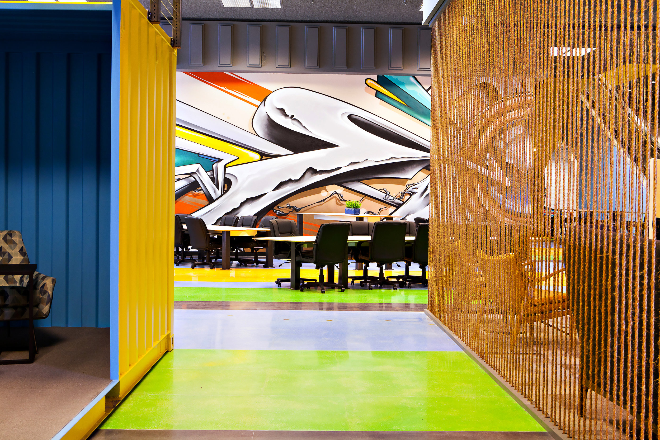 Pinball and video games are found around the corner, three shipping containers turned into conference rooms line the hallways.