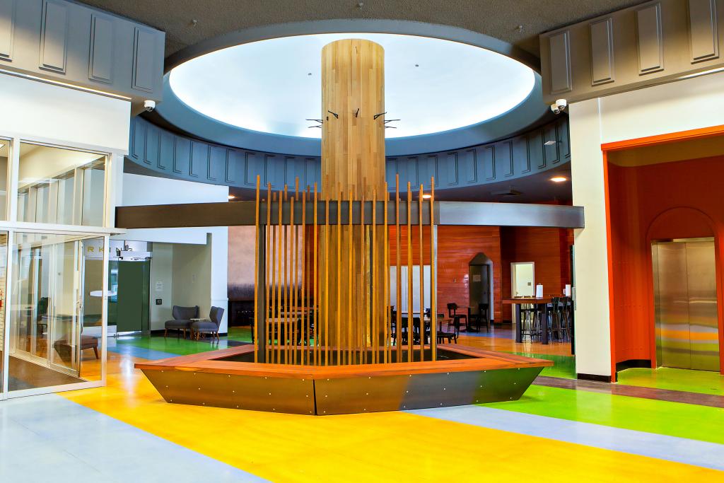 In the center of the 1st floor, we created a large fountain with surrounding bench seating. This splashing water makes a nice amount of white noise, solving sound issues in this large open space.