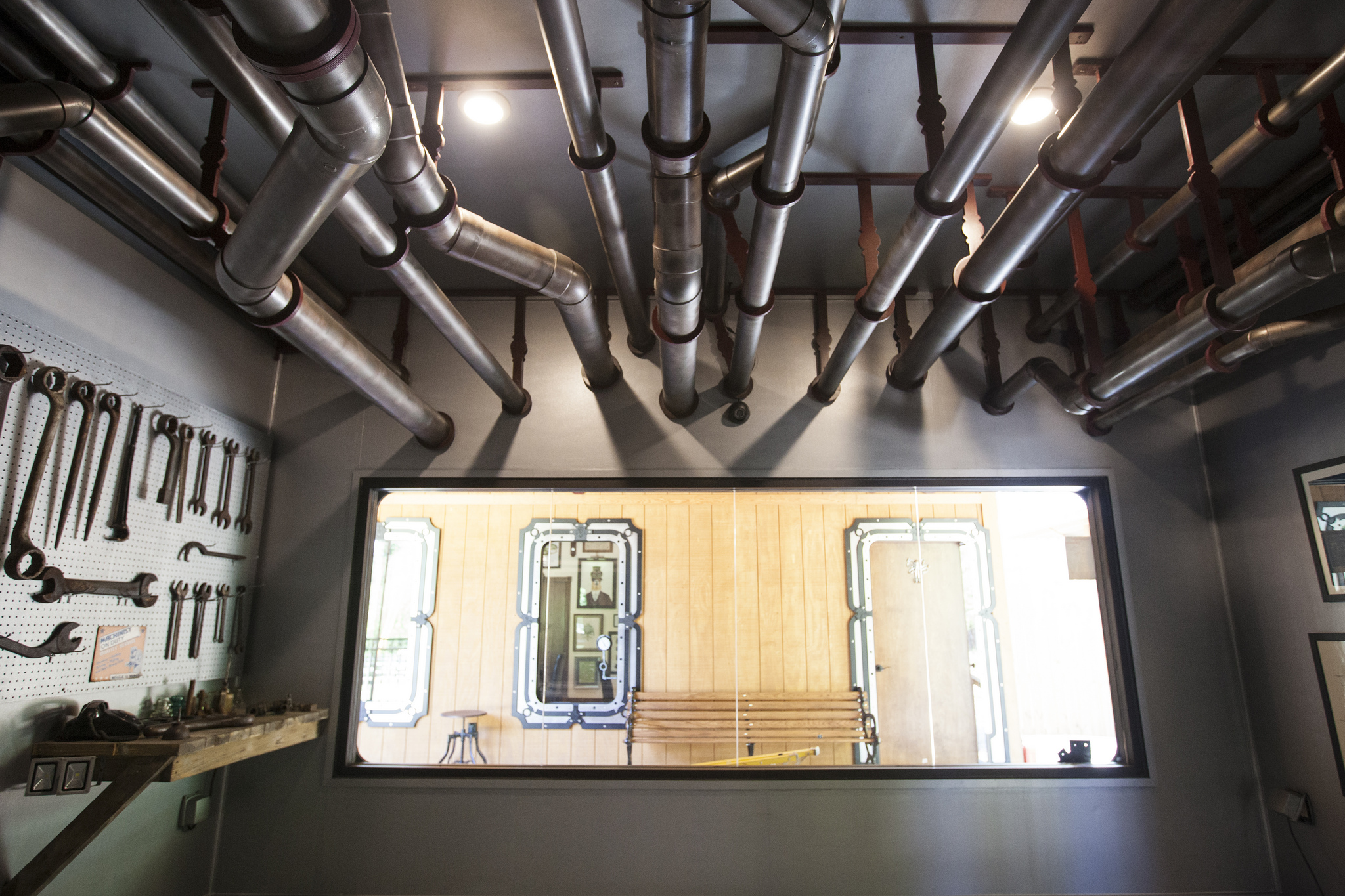 Designed to look like an engine room, the ceiling and back wall of the Tortoise House are covered in pipes and an electrically operable piston.