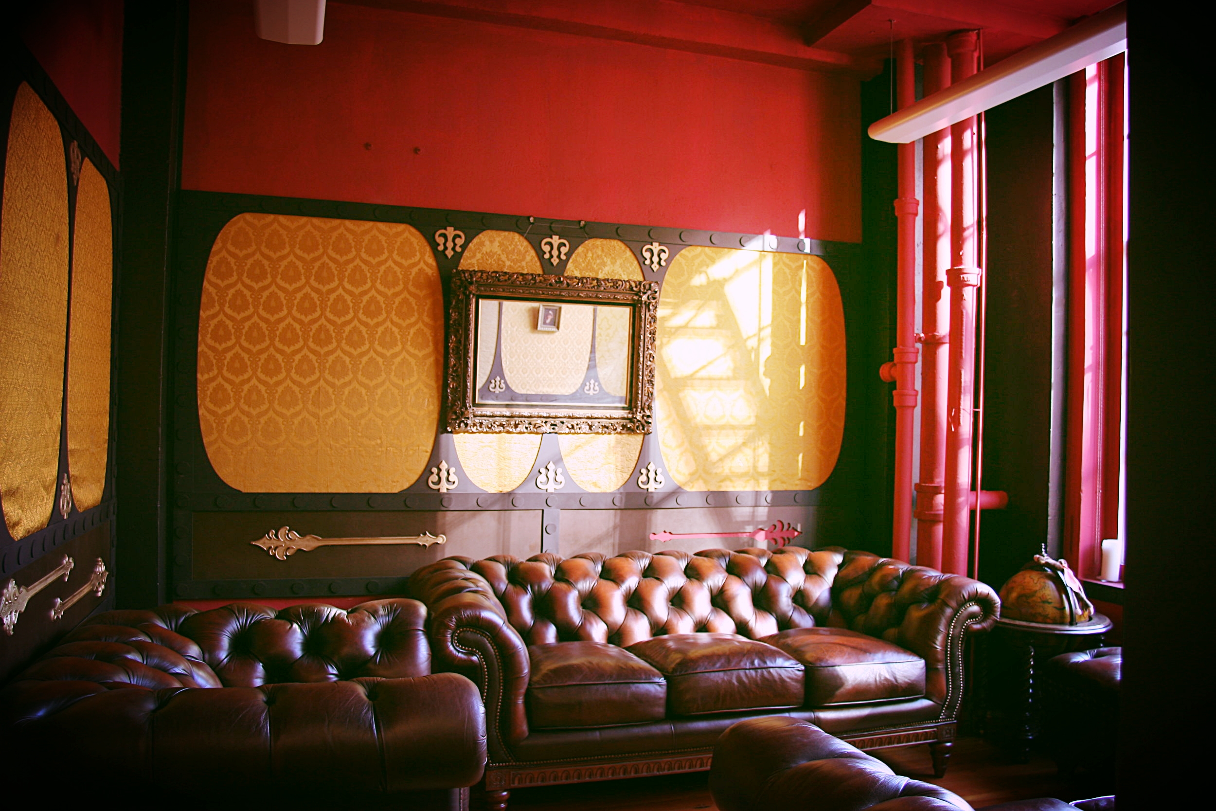  The secret room's furnishings, big,&nbsp;plush leather sofas, were acquired used from a Craigslist poster. 