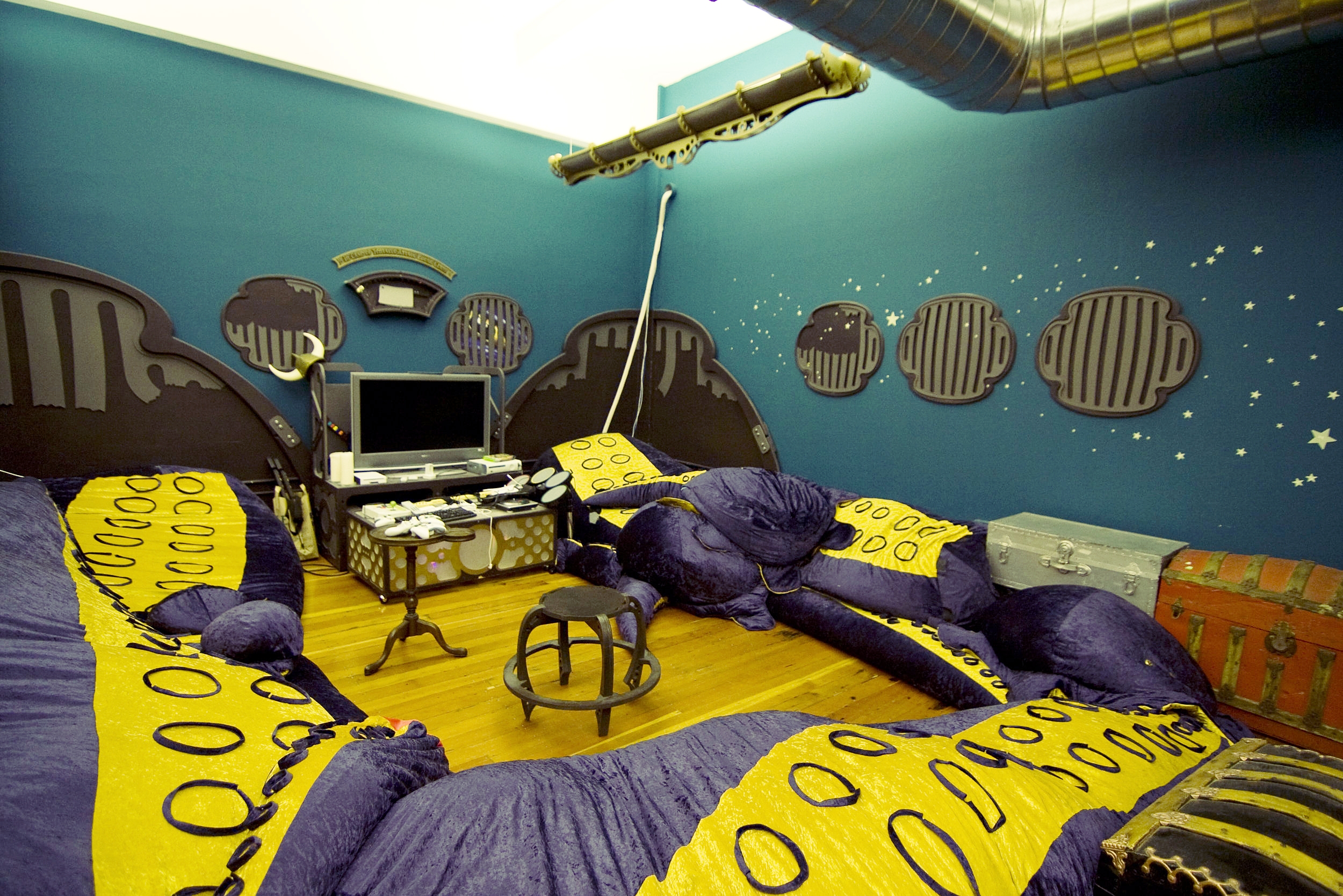 Seating in the gaming room is provided by the plush tentacles of an attacking octopus, which look as though they are being forced into the sub from the deep depths of the ocean.