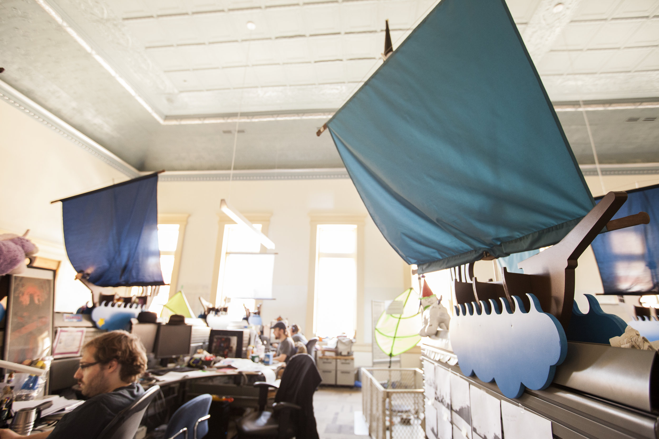 Different color shade sales throughout the office add color variation within a consistent pallet. This allows for some way finding and employee choice for color options near their desks. 