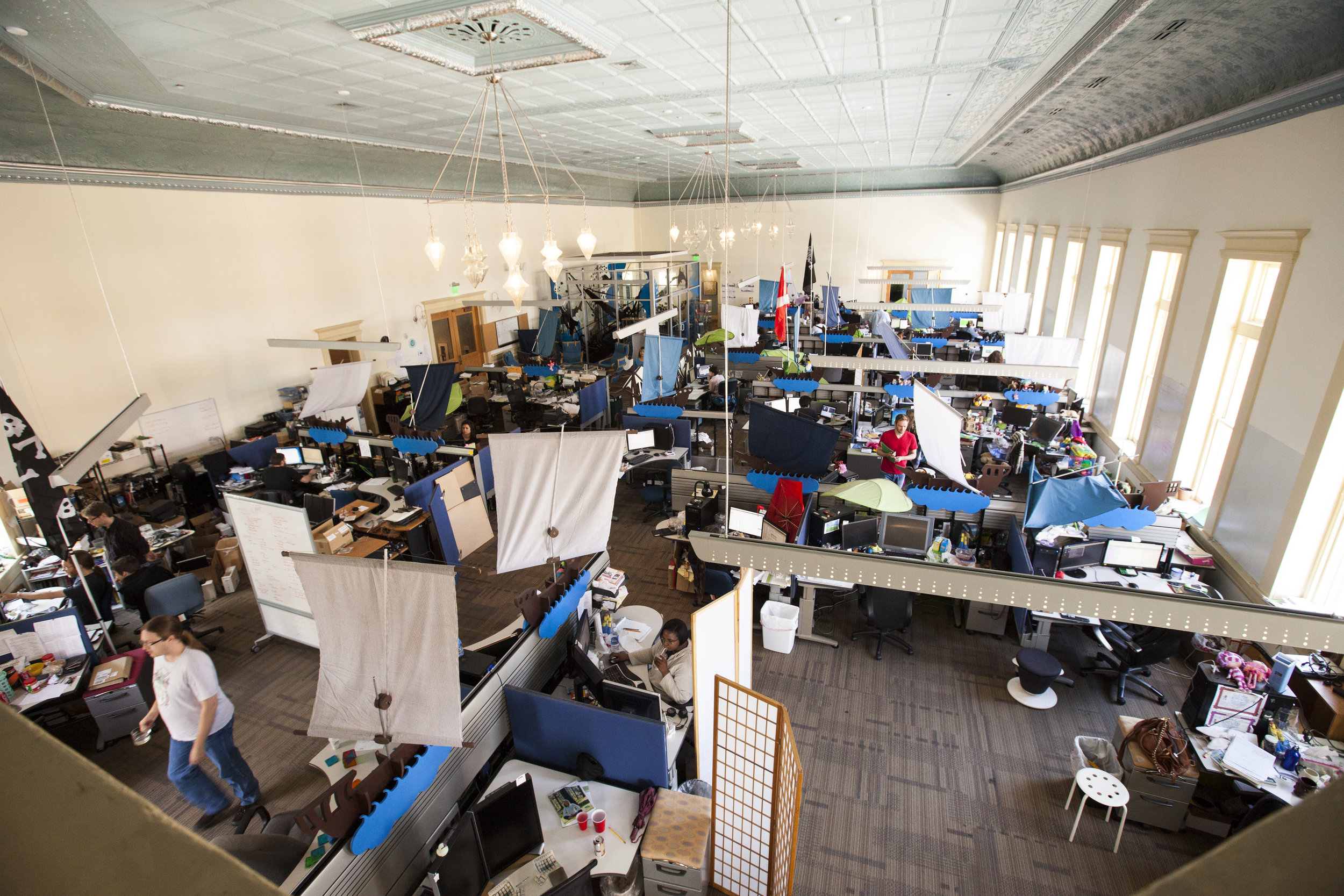 From the balcony above you can see the main open work space, now filled with our 'sun sails' (to help with glare at desks) and the large ship dividers.