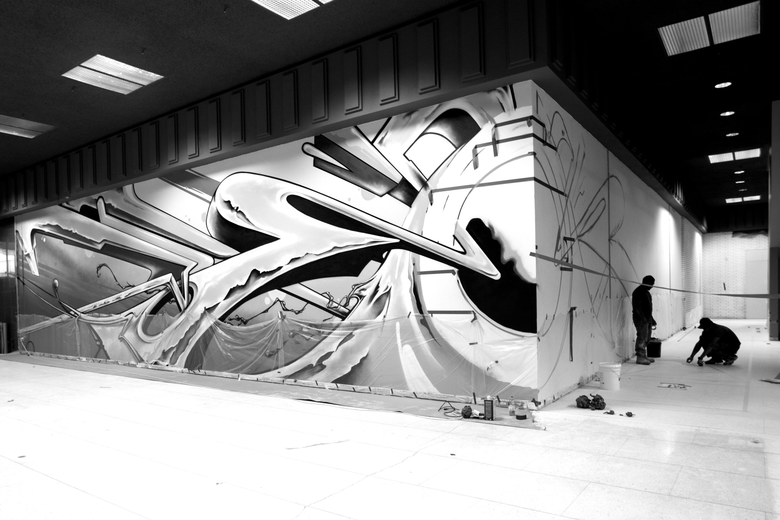 The mural in progress. The center is a "Porthole" - referenceing the facility's name "The Port Workspace"