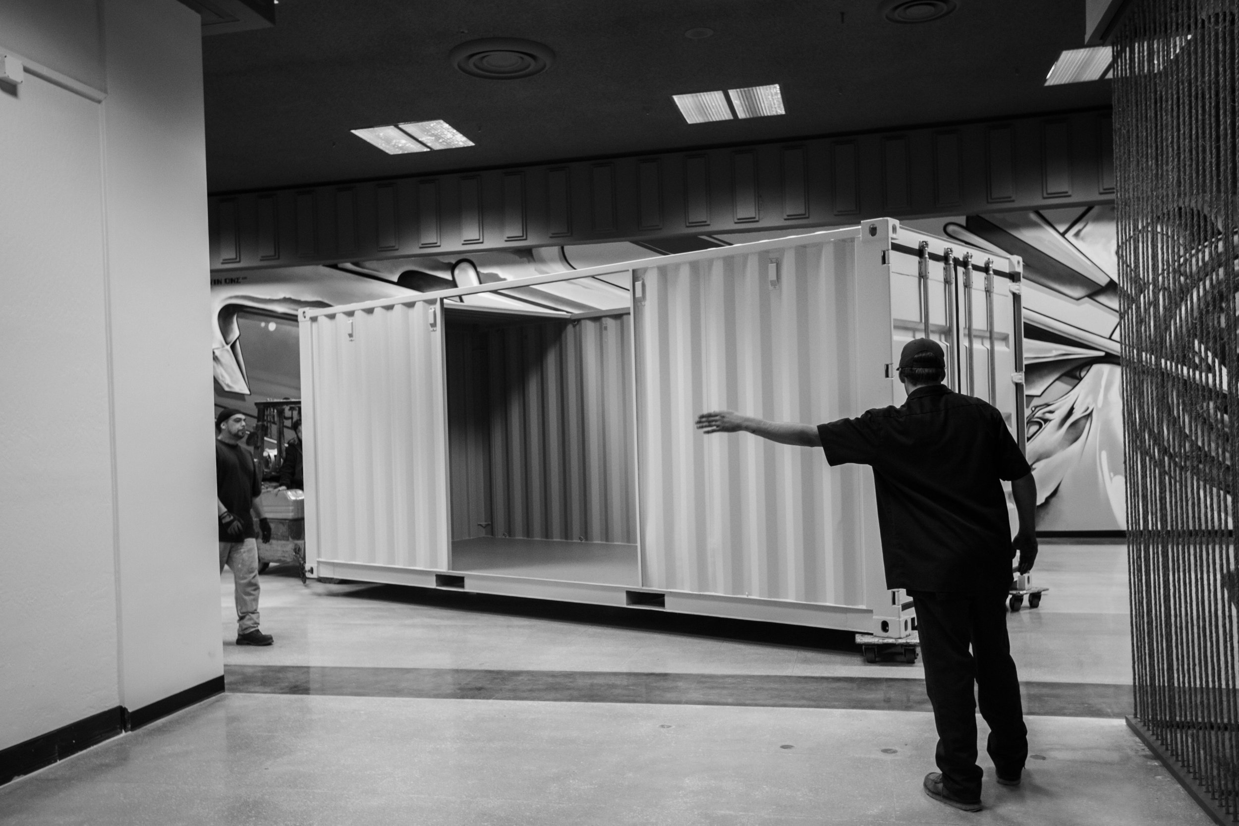 Bringing the containers into the space was no small job. Specialty movers and equipment were used to assure the floor was not dammaged, as it had just been re-done.