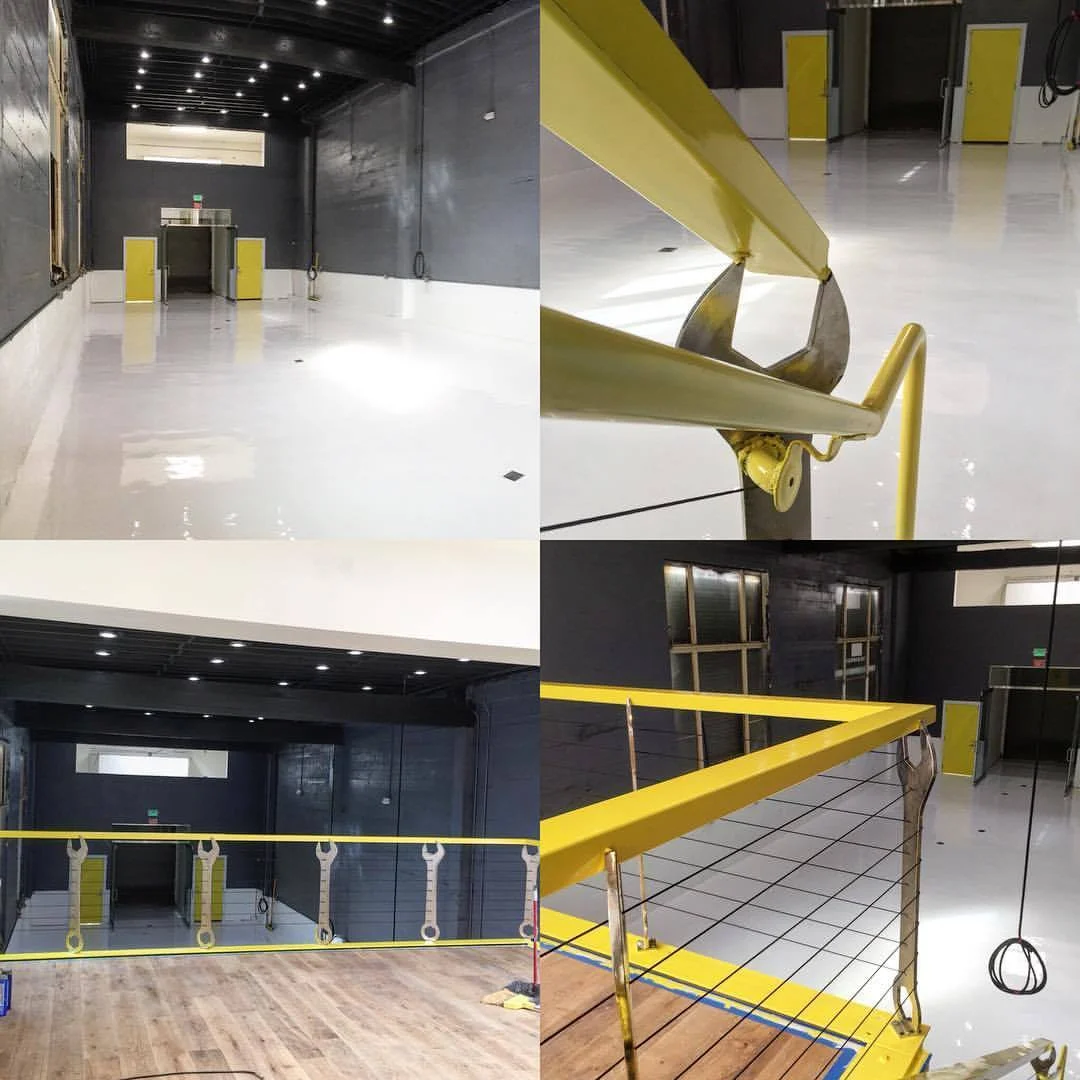 The bright modern color scheme adds some modern touches into this very utilitarian work space. Empty now, it will soon be filled with cars and a vibrant team of kids engaged in the mission. Photo courtesy of Project Wreckless
