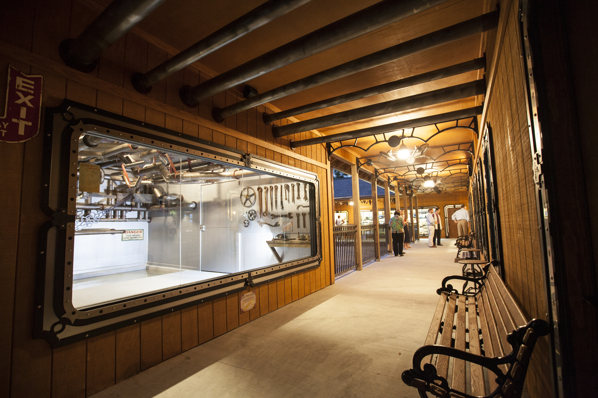  A large window looking into the tortoise house. Here they can take shelter from the elements and get a nice soak in their pool.&nbsp; This room we designed to look like the "engine room", complete with faux pipes on the ceiling and a large roatating