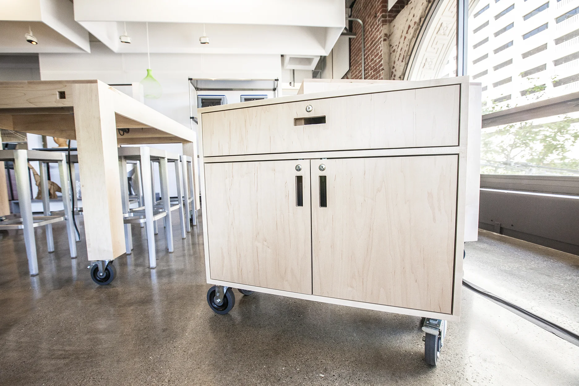 A rolling cabinet designed to hold 14 laptops for the gallery classes.