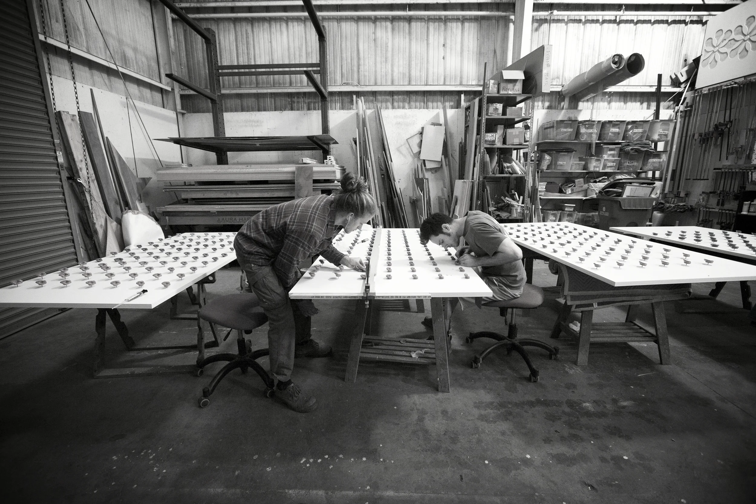 After drilling the holes and applying the ears onto the panels, we created jigs to assure each one was orientated perfectly; making the assembly process of these ear panels fast, fool proof and looking great.