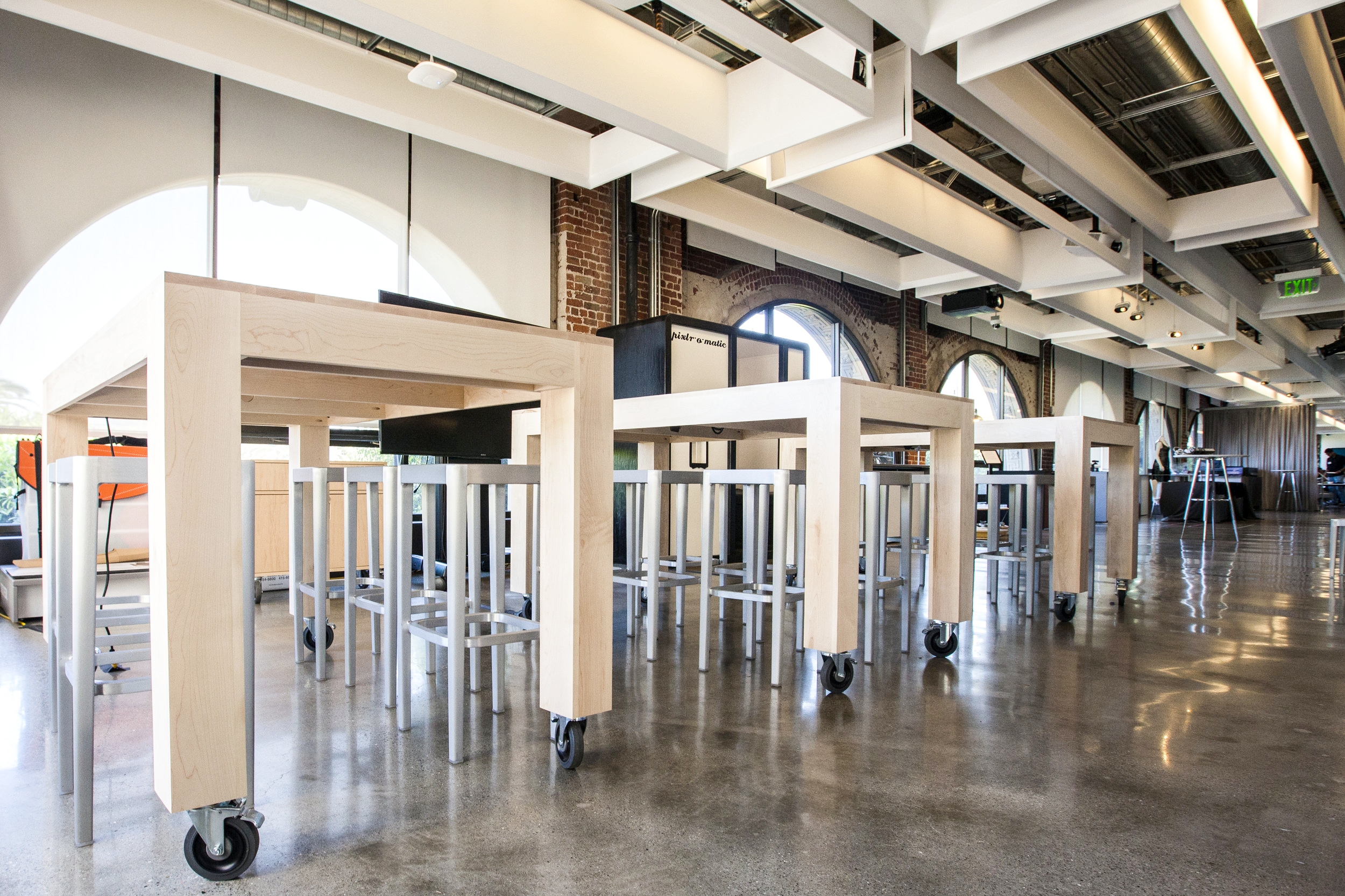  In the SF gallery space, the modern square design of these tables goes well with the interior of the space. 