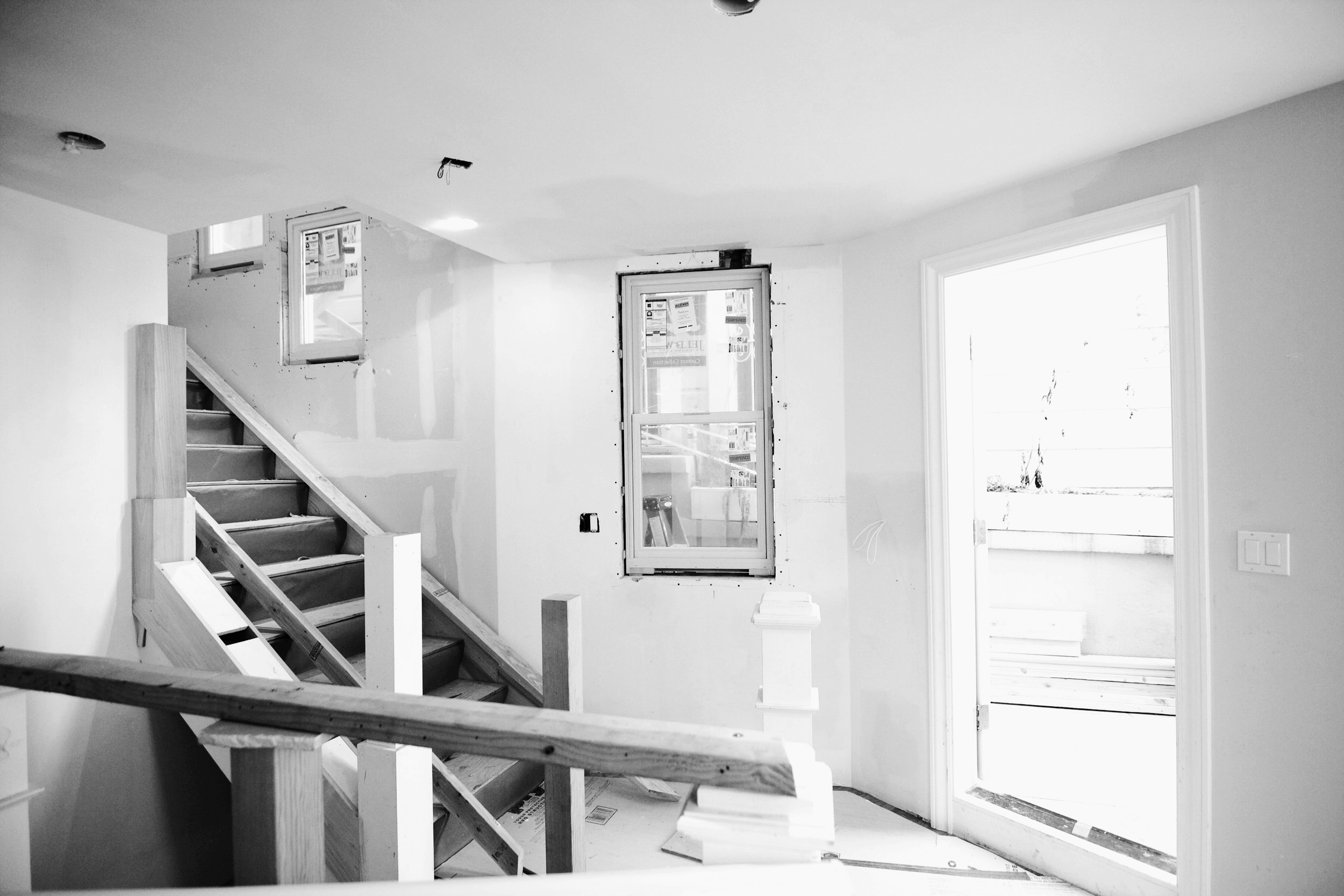  Before, one would have to go outside to access the basement. The new stairs to the lower level basement is now tucked behind the existing stair. By making this minor change, we enabled fluid movement throughout all levels of the home. 