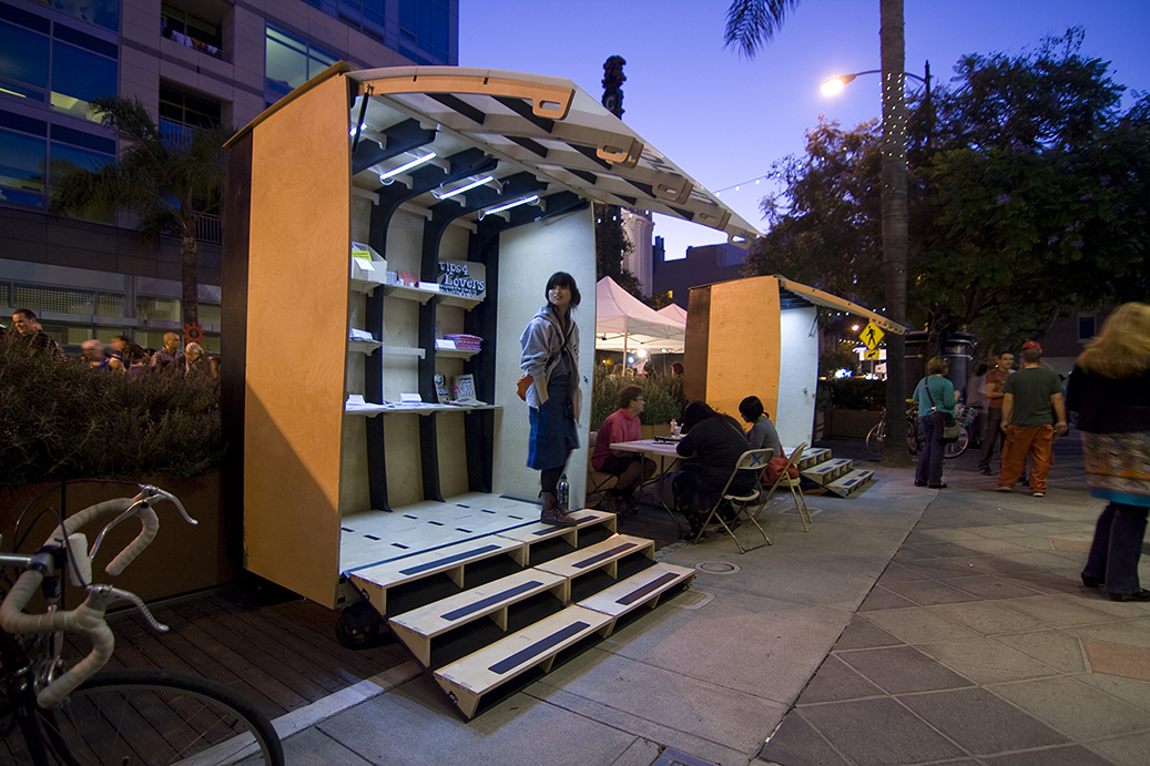  To be used during the First Fridays Art Walk in downtown San Jose, CA, these rolling, fold out art galleries were designed to be configurable into varrious positions, and be able to display a variety of different kinds of art. 