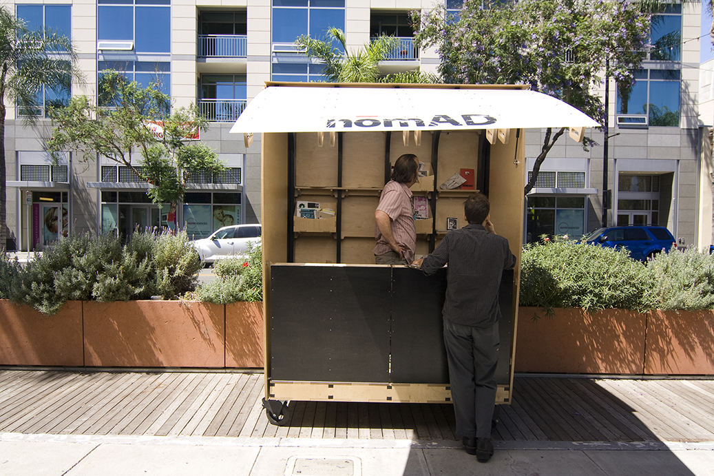  With the stairs folded up one can access the inside through a side door. This gives the piece a more kiosk feel. 