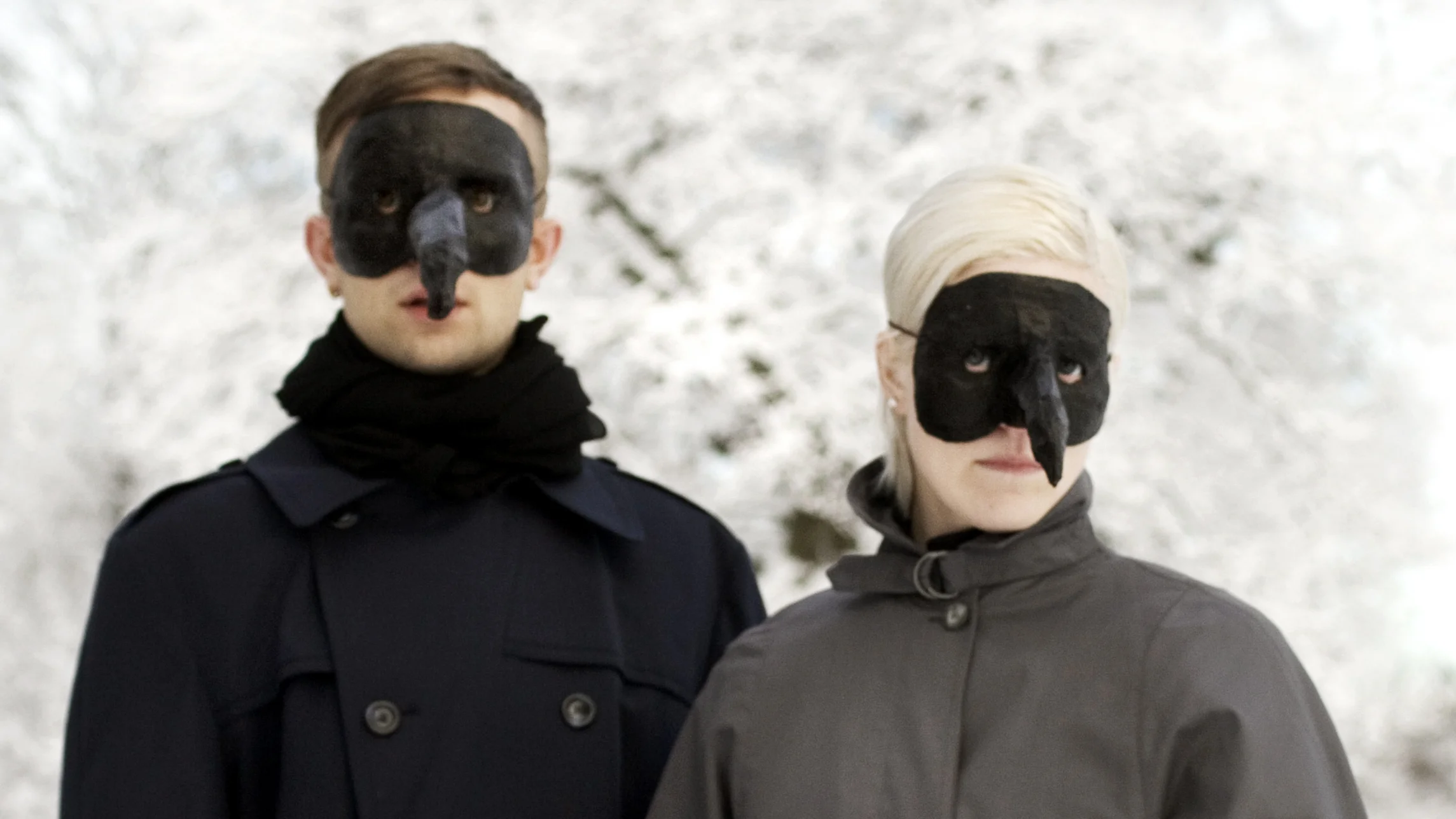 Olof and Karin Dreijer Andersson wearing their iconic Plague Doctor masks.