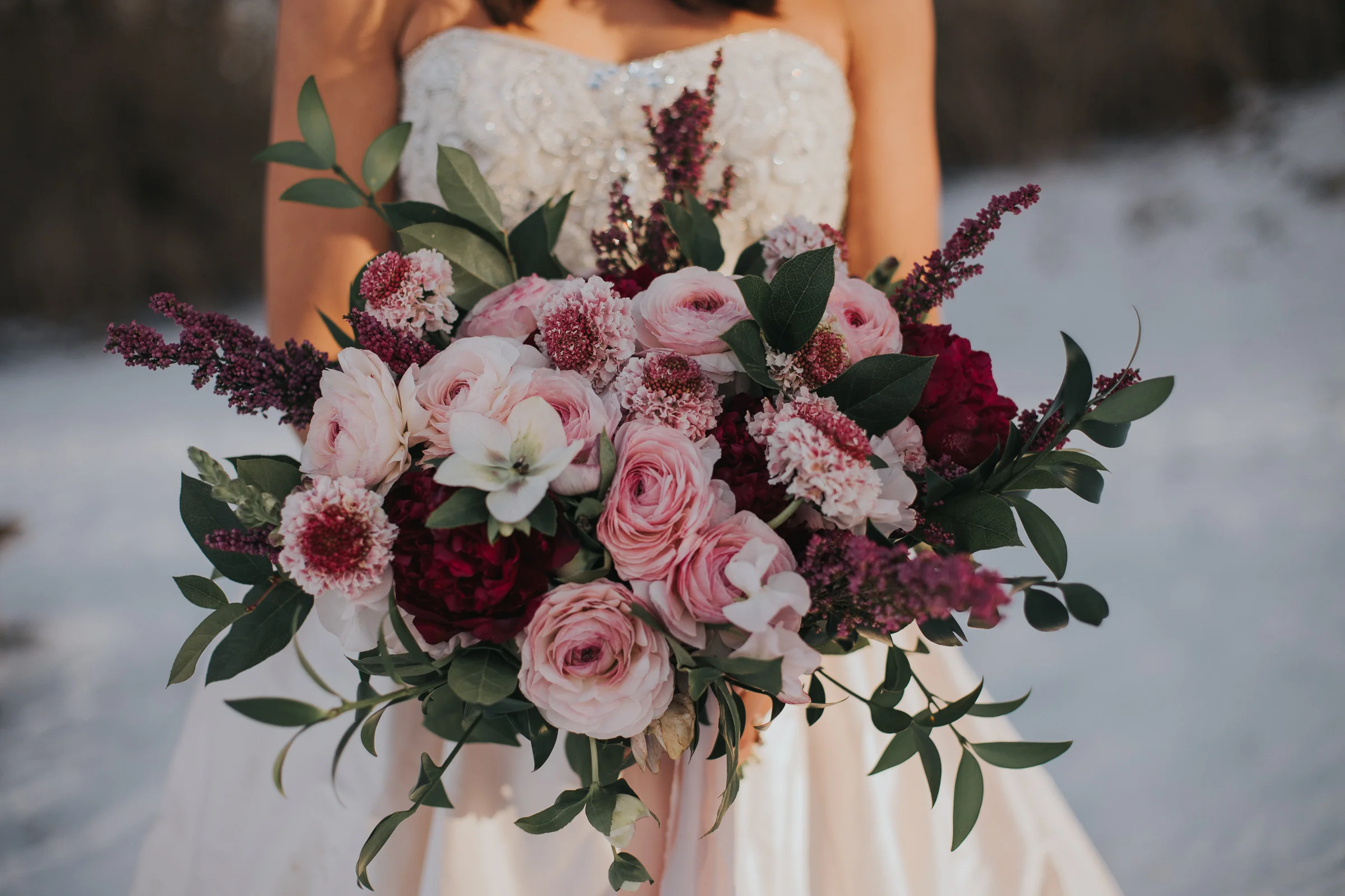 Organic garden bouquet Style: romantic, wispy Details: Clooney ranunculus, hellebore, scabiosa, burgundy peonies, heather, ruscus, salal {Photo courtesy of Morgan Barrett }
