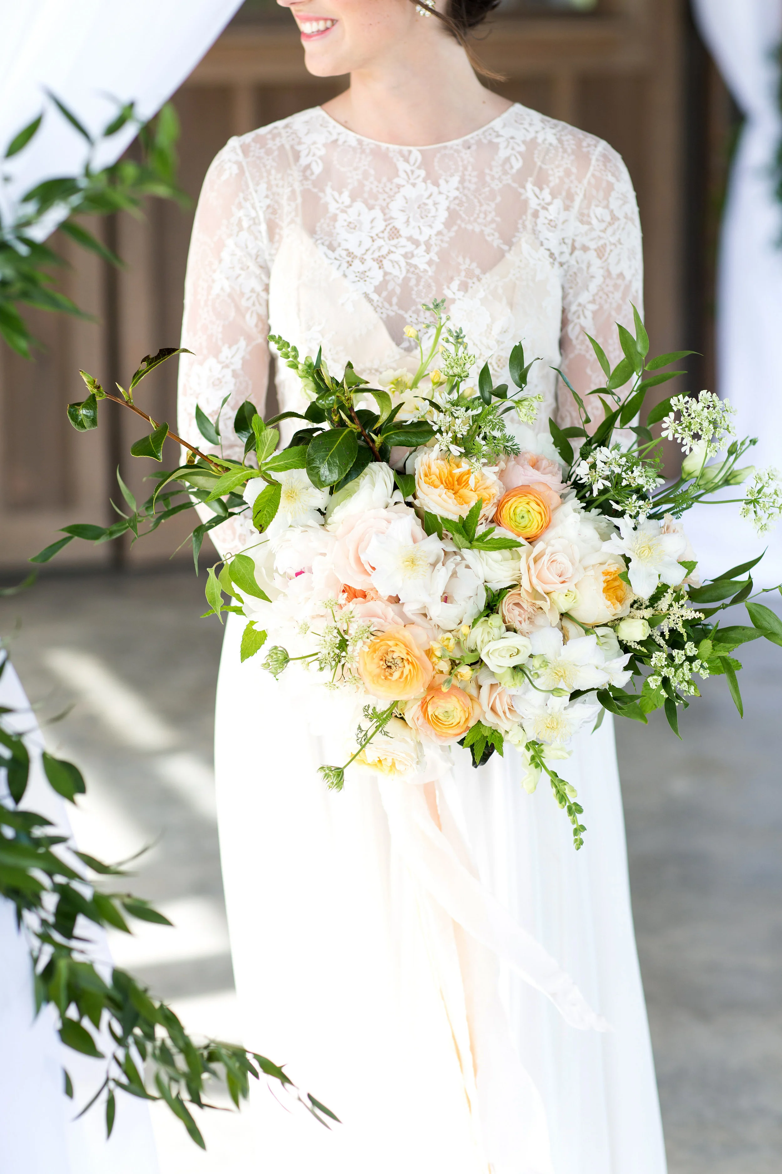 Wispy Garden Bouquet Style: rustic, wispy, organic Details: ranunculus, lisianthus, stock, clematis, peonies, Juliet garden roses, full greenery {Photo courtesy of Melissa and Beth }