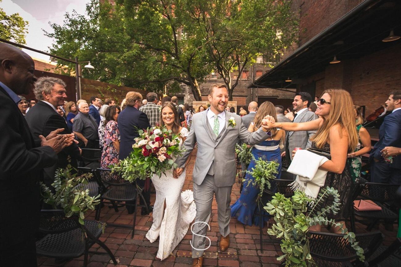 Downtown-Kansas-City-Wedding-Venues-Feasts-Of-Fancy-Ceremony-Exit.jpg