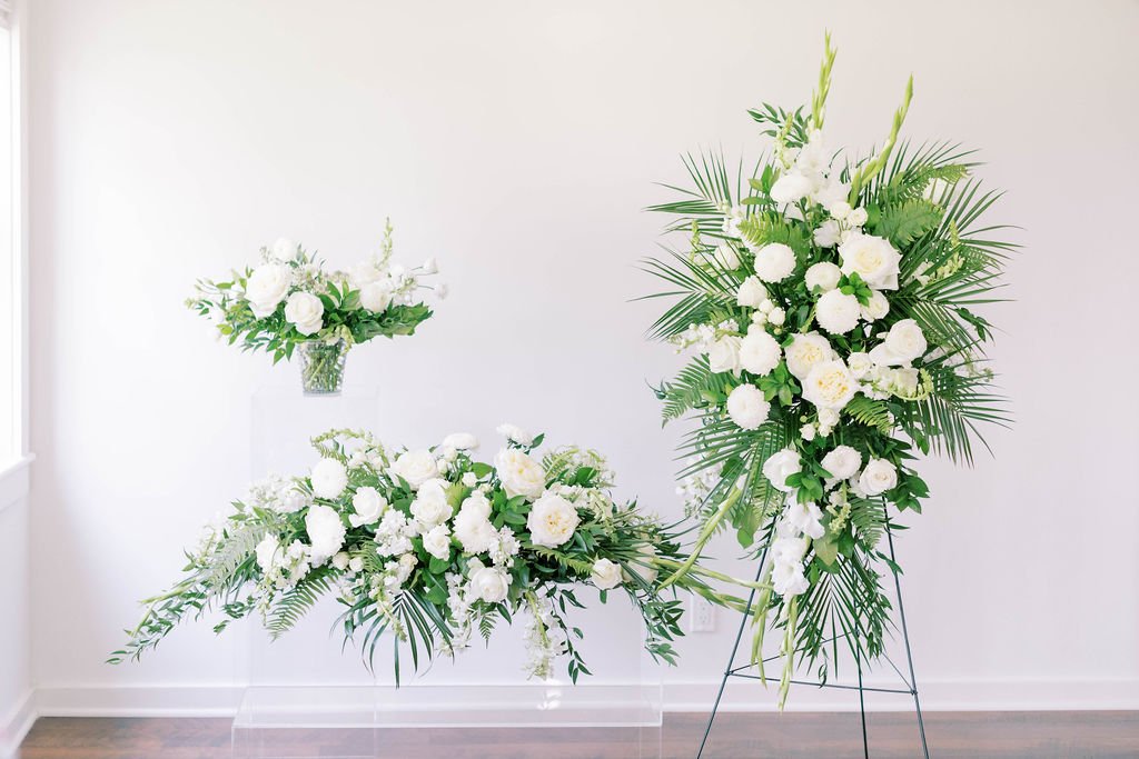 For the Family: Casket and standing sprays with large vase arrangement