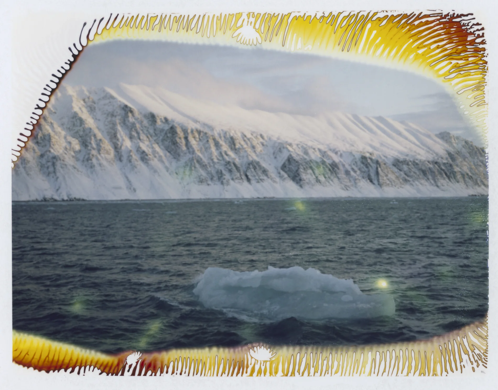 Proving Grounds unique instant film prints, 4 x 5 inches These unique instant prints were created while at sea in the archipelago of Svalbard within the Arctic Circle. In this vast place I documented the landscape as it unfolded before me; however, my camera and film were limited by the subzero environment and froze creating unexpected chemical trails, color shifts, and light leaks. These semi-failures of the medium created unexpected results that reflect my own memory of this otherworldly place, something that resides between a dream and reality.
