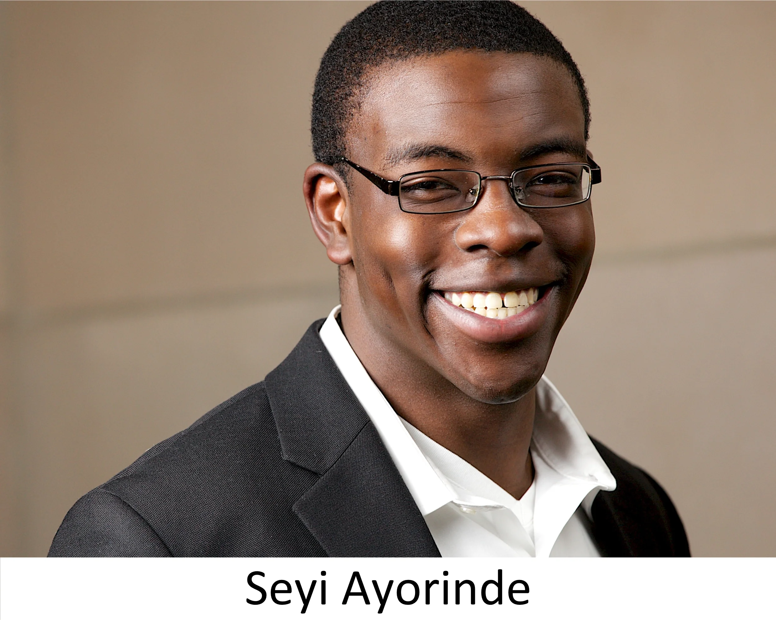 SeyiAyorinde_Headshot_GlassesSmile.jpg