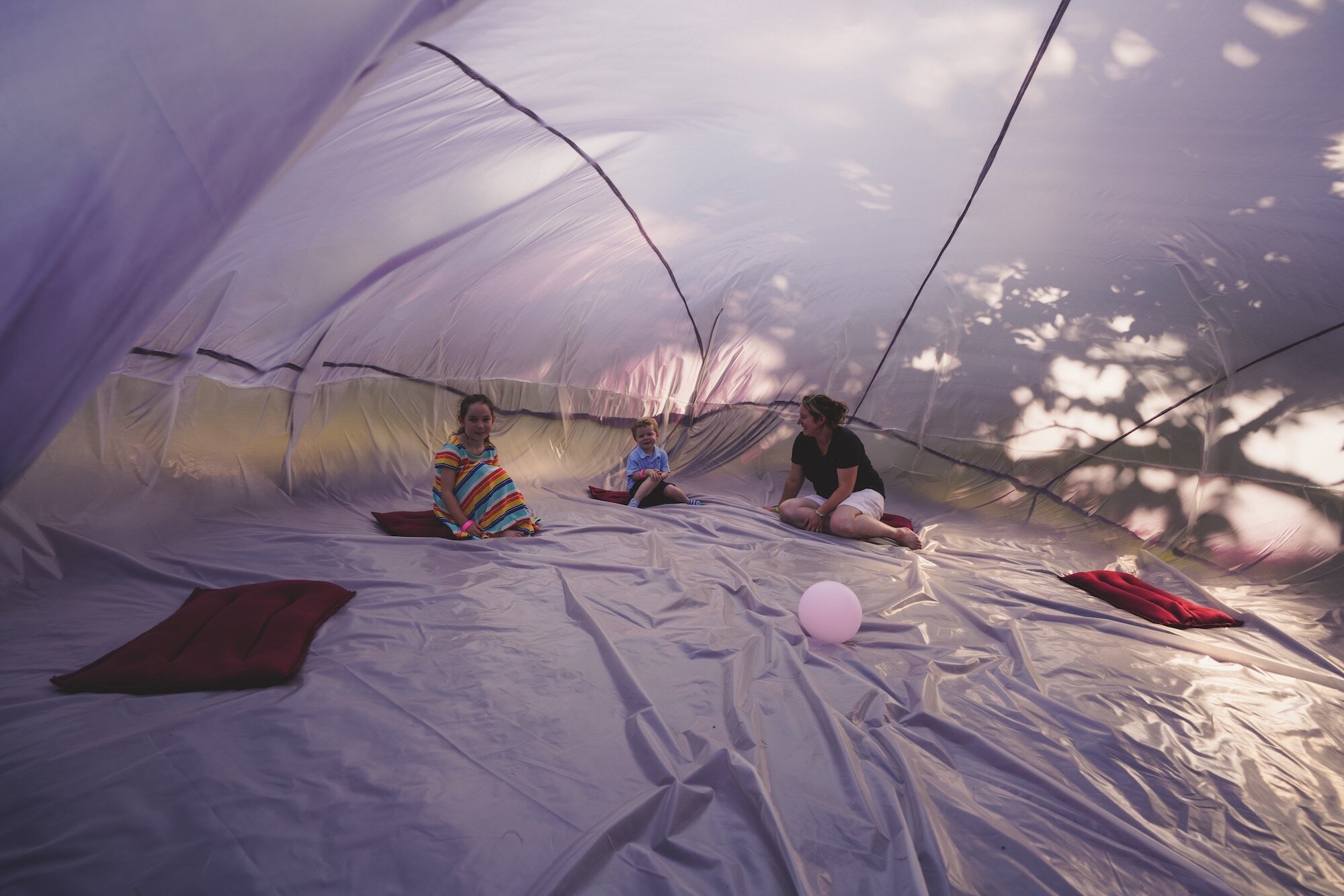 Leslie Fandrich with Milo and Quinn Janata, Inflatable Room (Womb), Dusklit 2019, Kimberly Sauer Photography