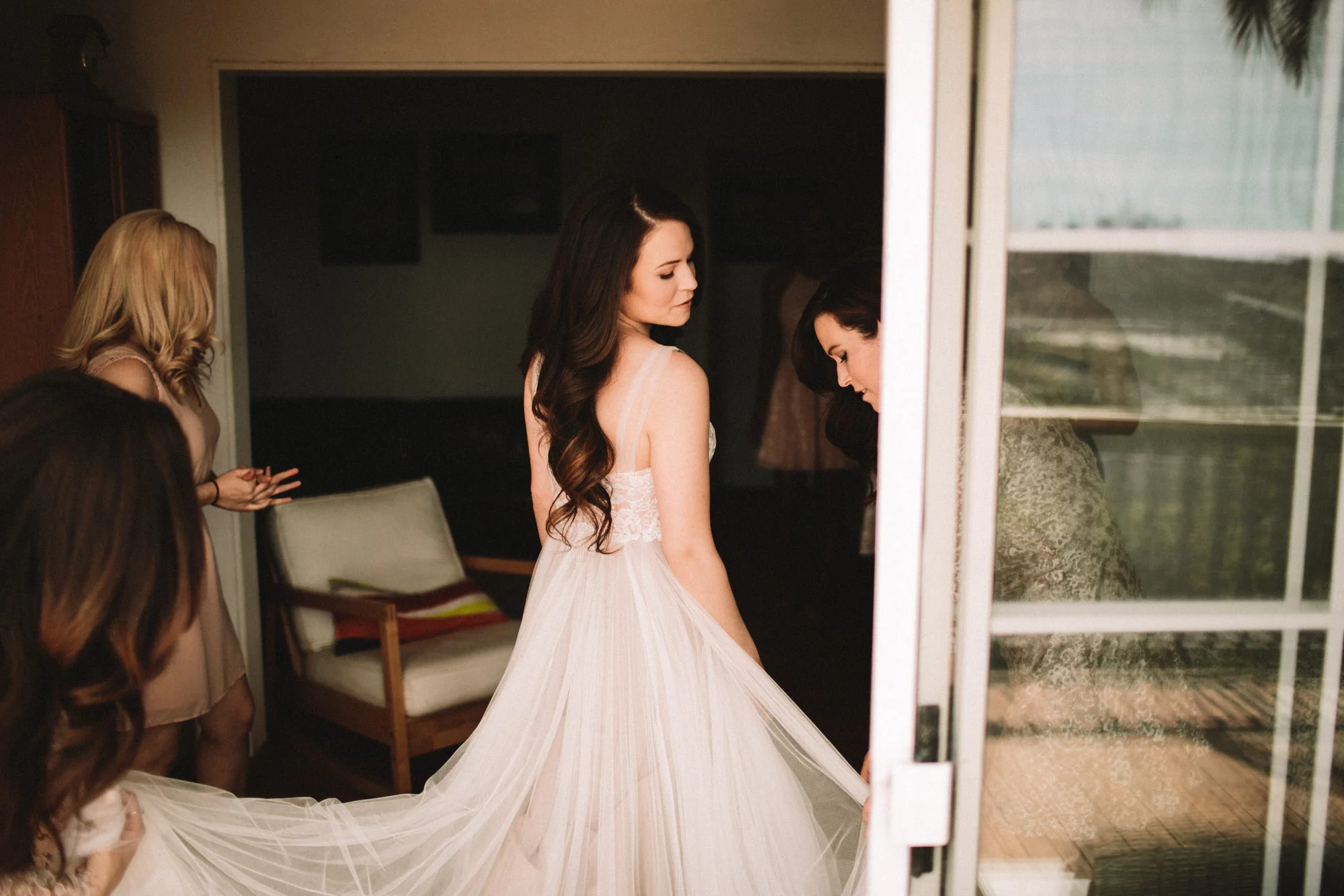 bride getting in her dress