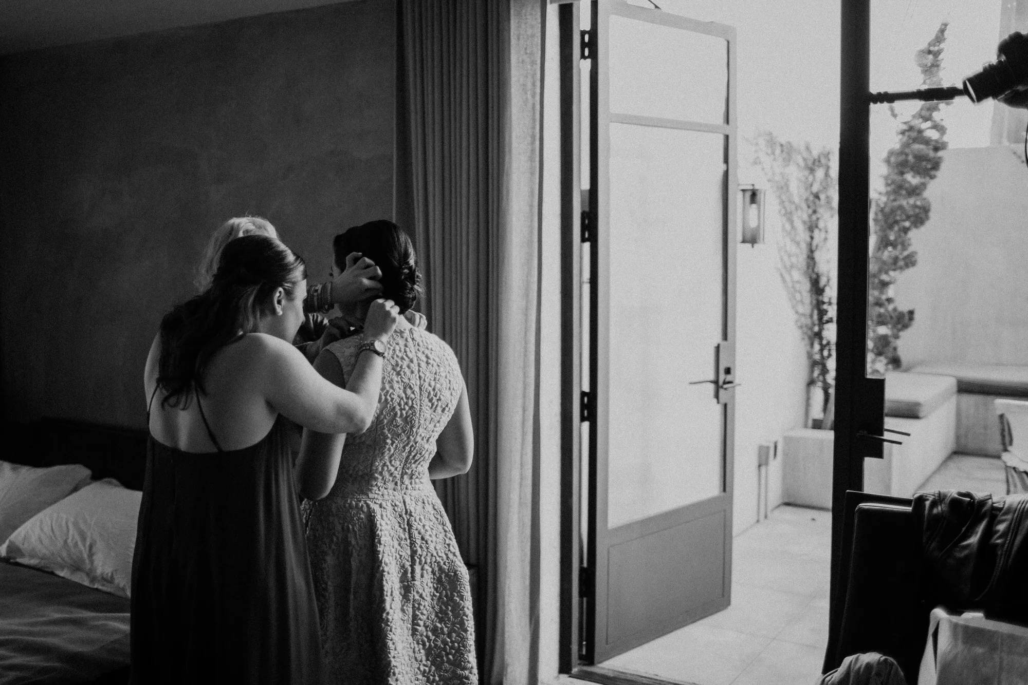sasha putting on her wedding dress