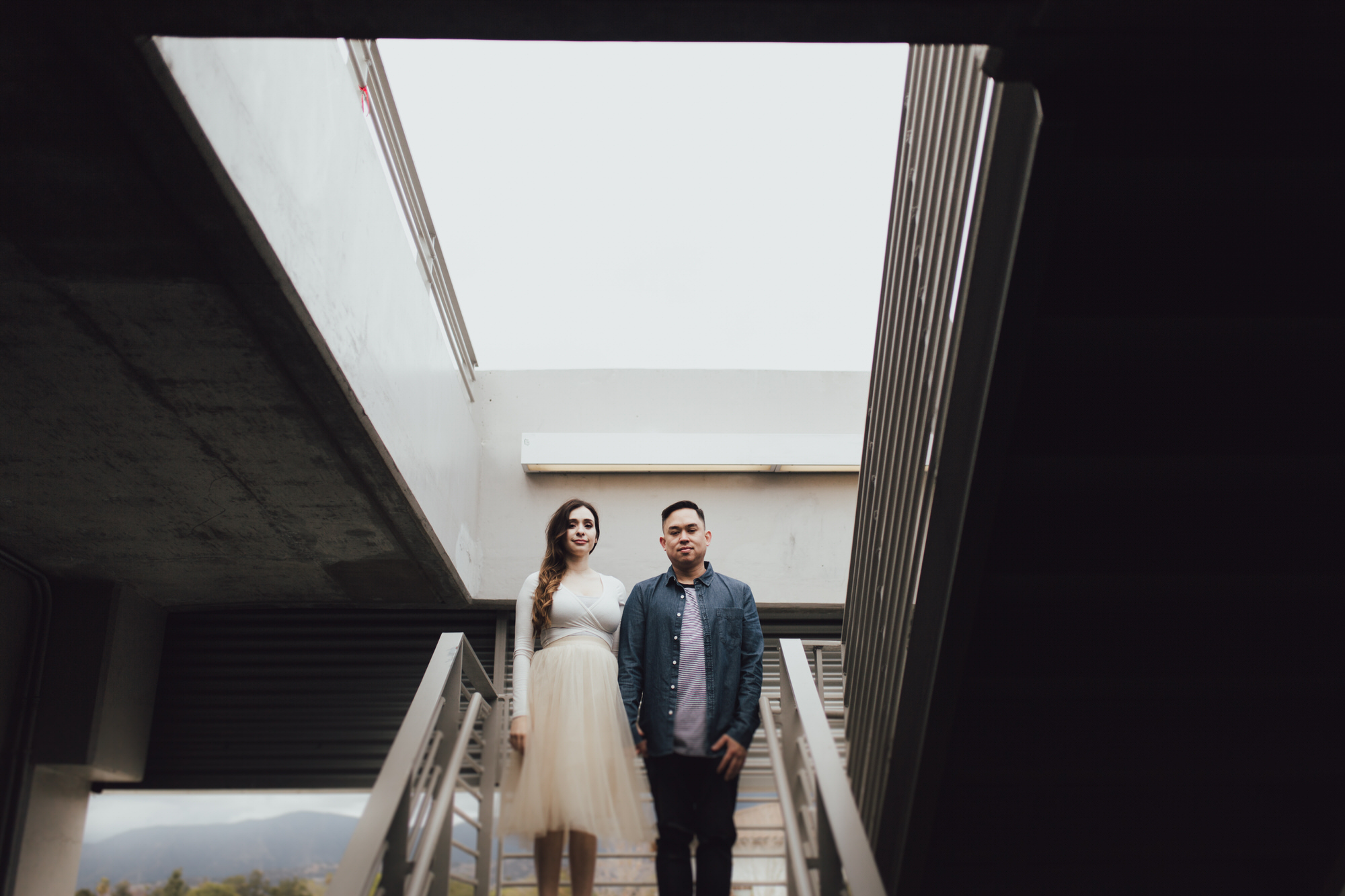 photos in a parking garage of vanessa and ryan