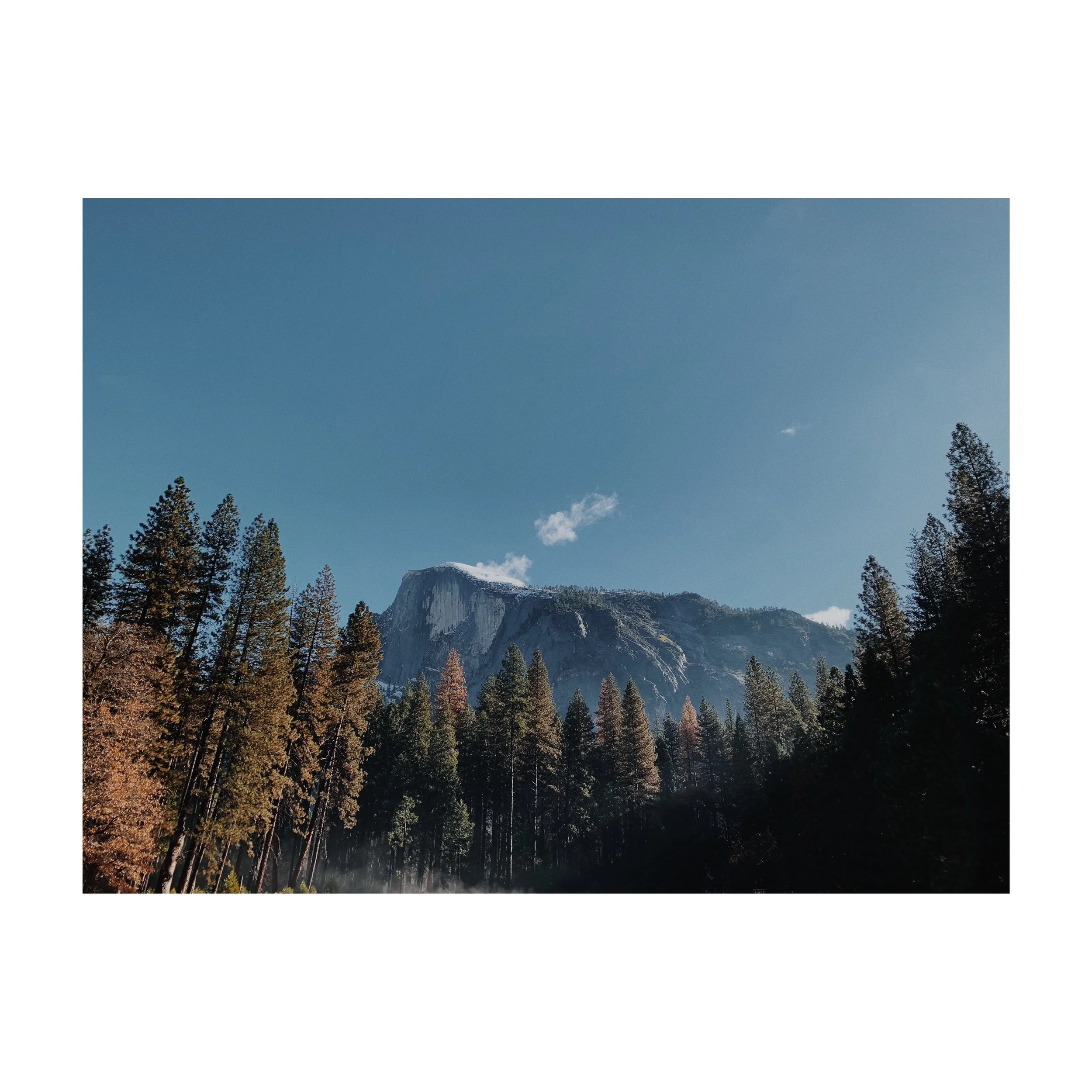 half dome with snow on the summit
