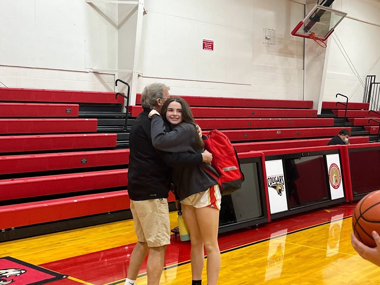 Sam hugs Gpa after game.jpg
