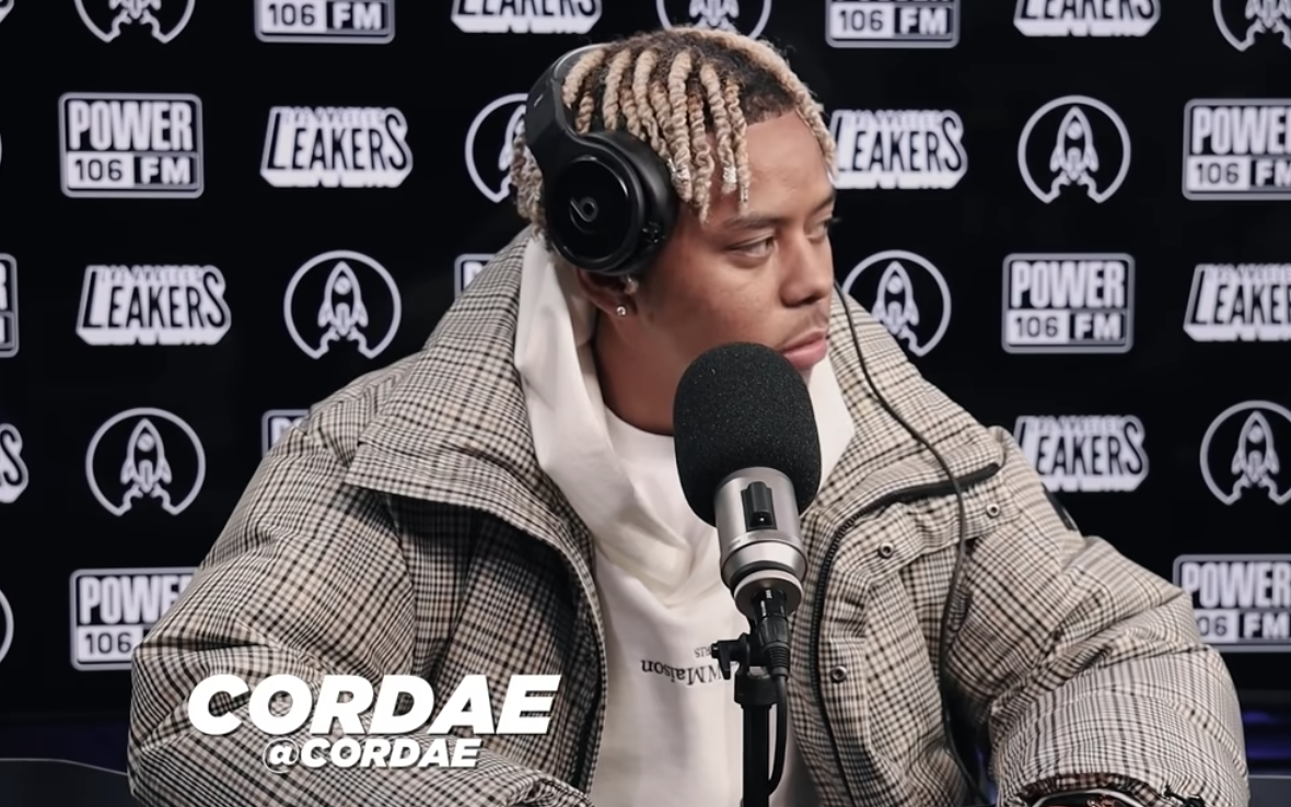 Cordae Spazzes Over Kodak Black's "Super Gremlin", Biggie's "Kick In The Door" In 3-Piece Freestyle