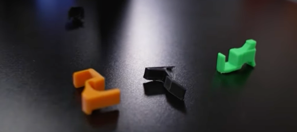 This piece of plastic can turn almost any gun into a machine gun
