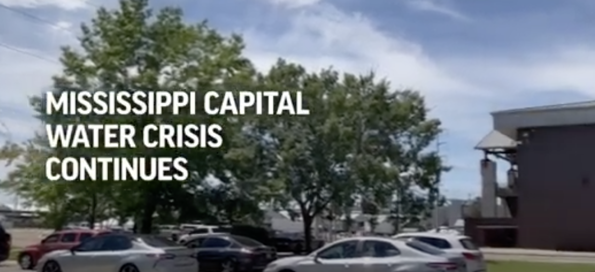People line up for water in Mississippi's capital