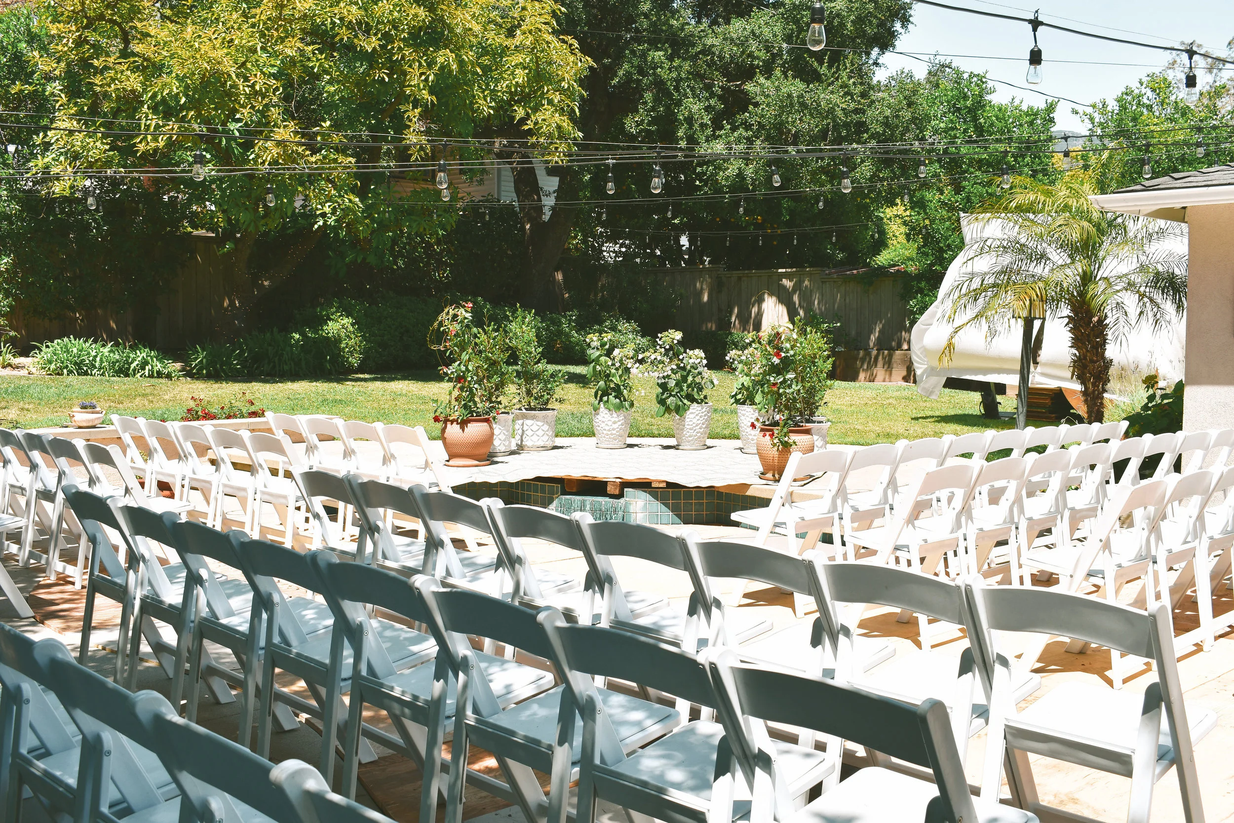 ceremony set up #lrqcfloral #backyardwedding