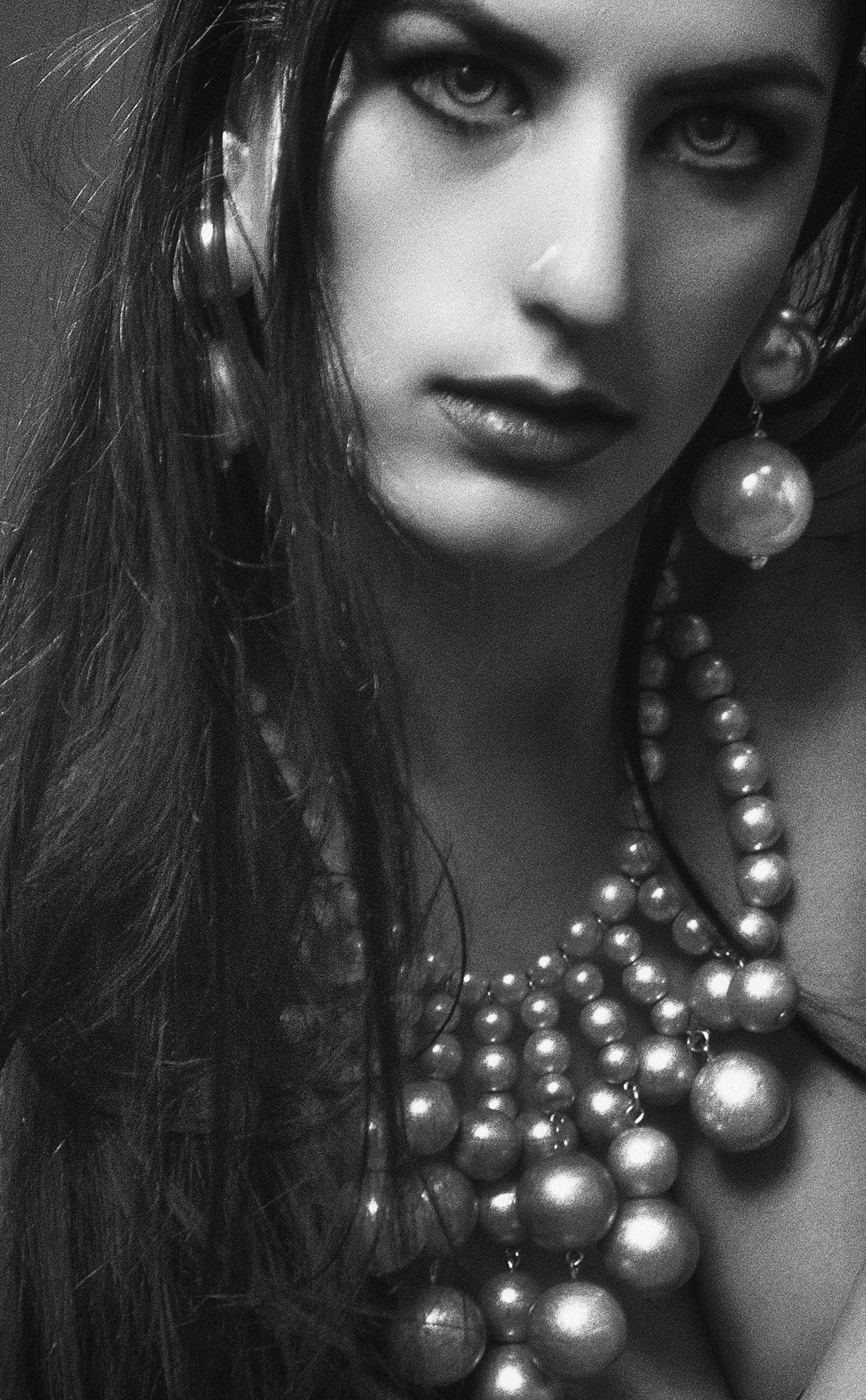 grayscale-photo-of-woman-wearing-beaded-necklace-and-dangle-1245564.jpg