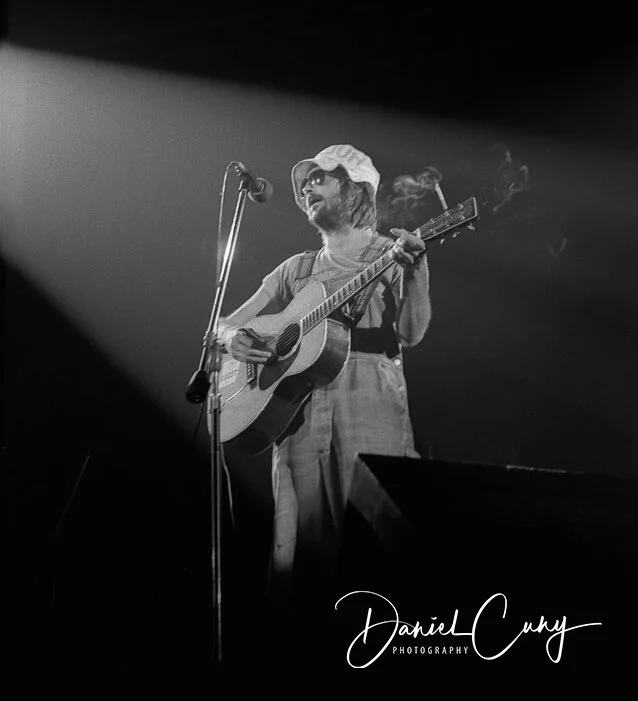 Eric Clapton performing with an acoustic guitar in California in July 1974.