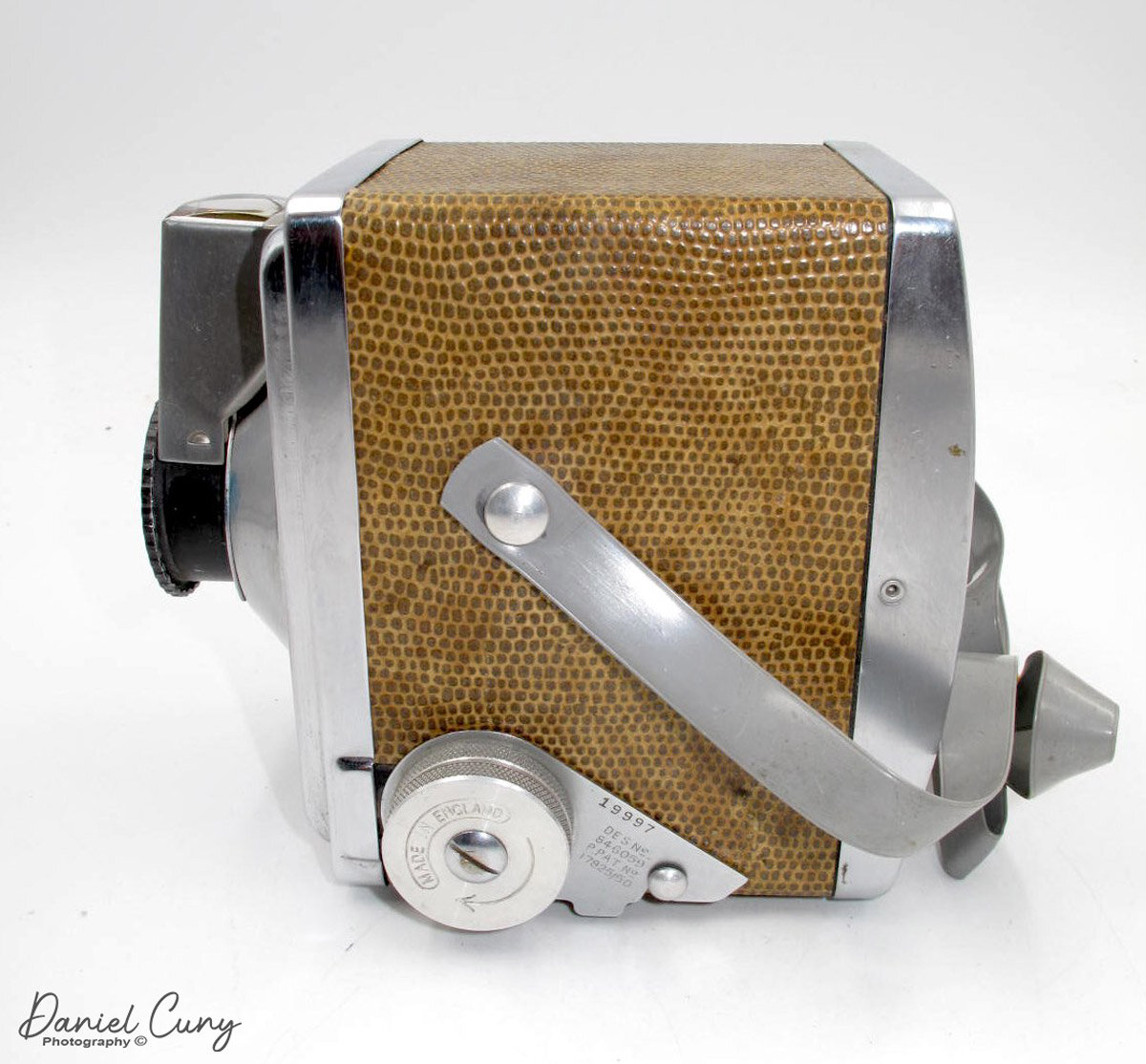 Left side of Gilbert box camera showing advance and locking mechanism.