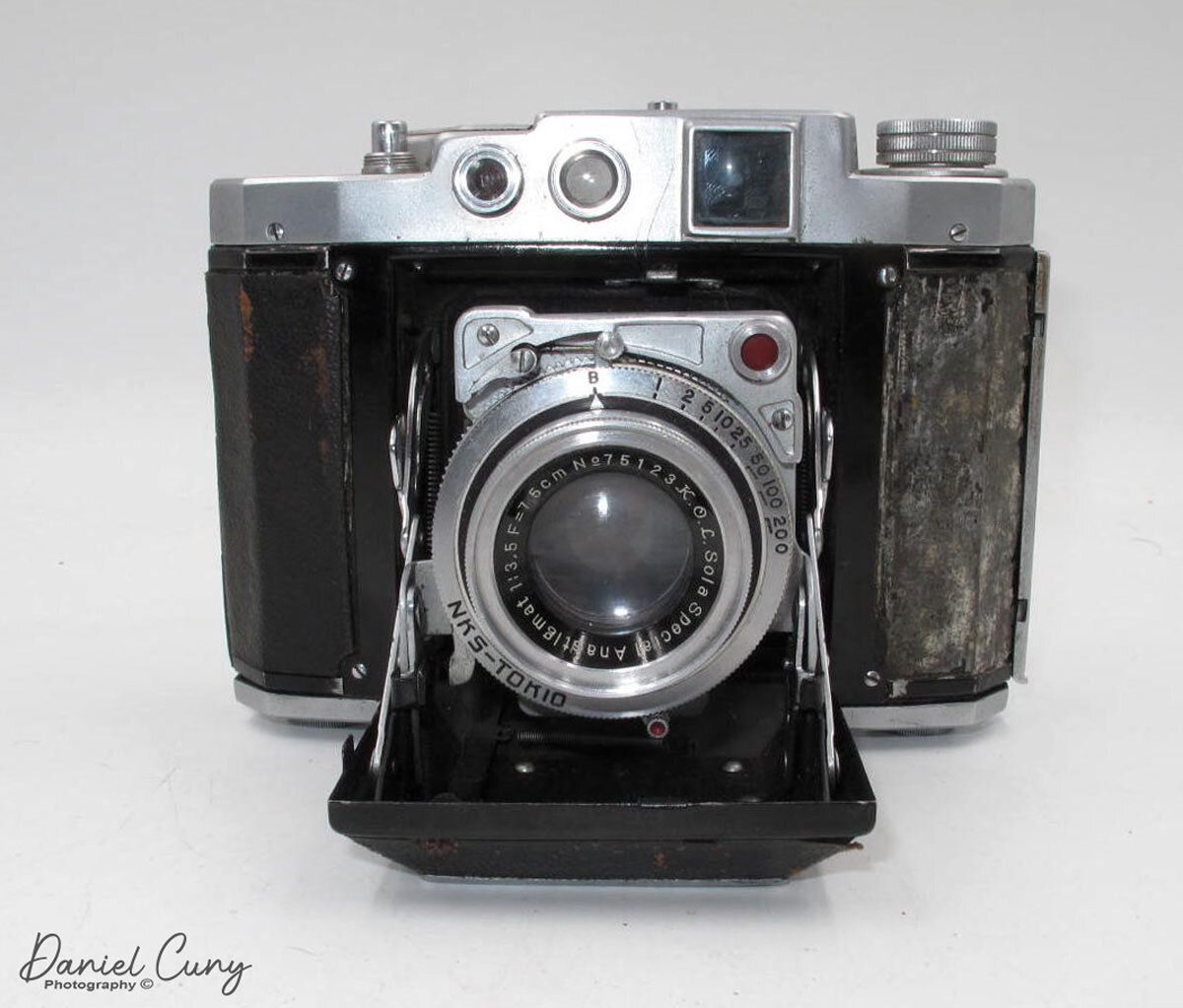 Front of Mamiya Six with lens open.