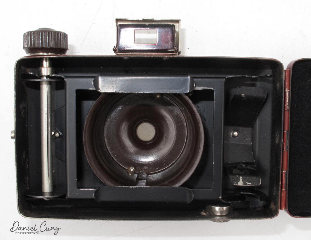 Back open with lens extended on the Ruberg Art Deco Camera