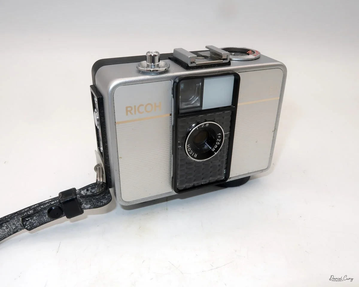 Different angles of the Ricoh Auto Half E2 camera
