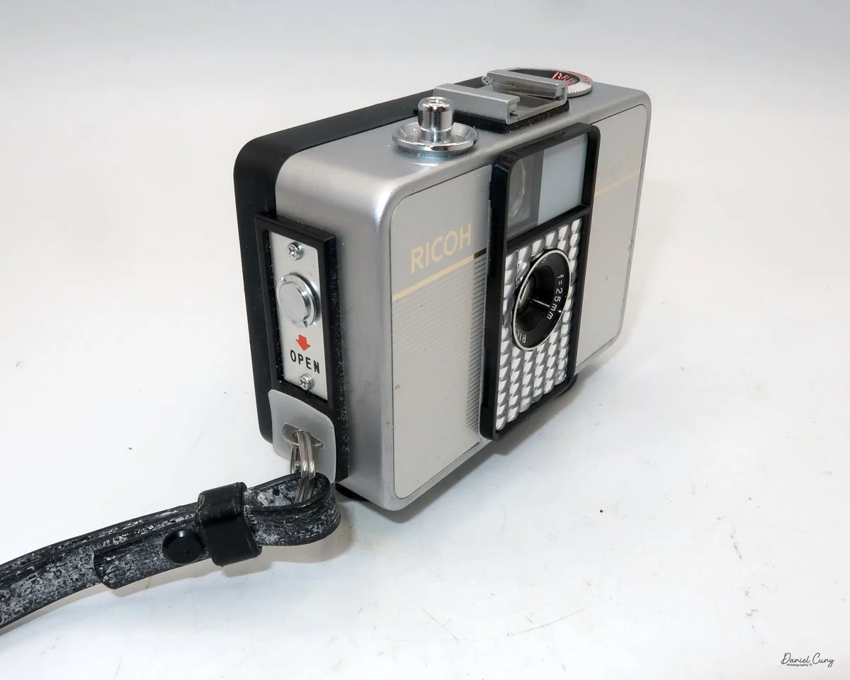 Different angles of the Ricoh Auto Half E2 camera