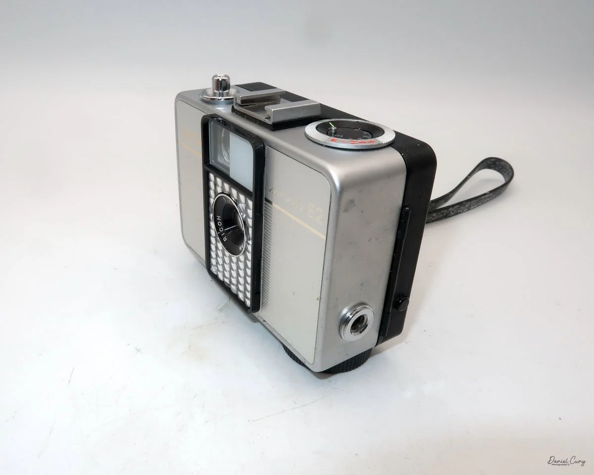 Different angles of the Ricoh Auto Half E2 camera