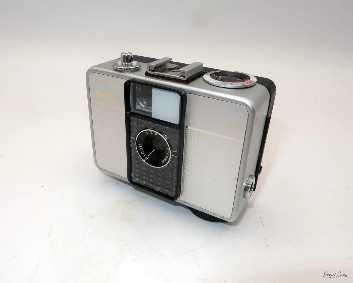 Different angles of the Ricoh Auto Half E2 camera