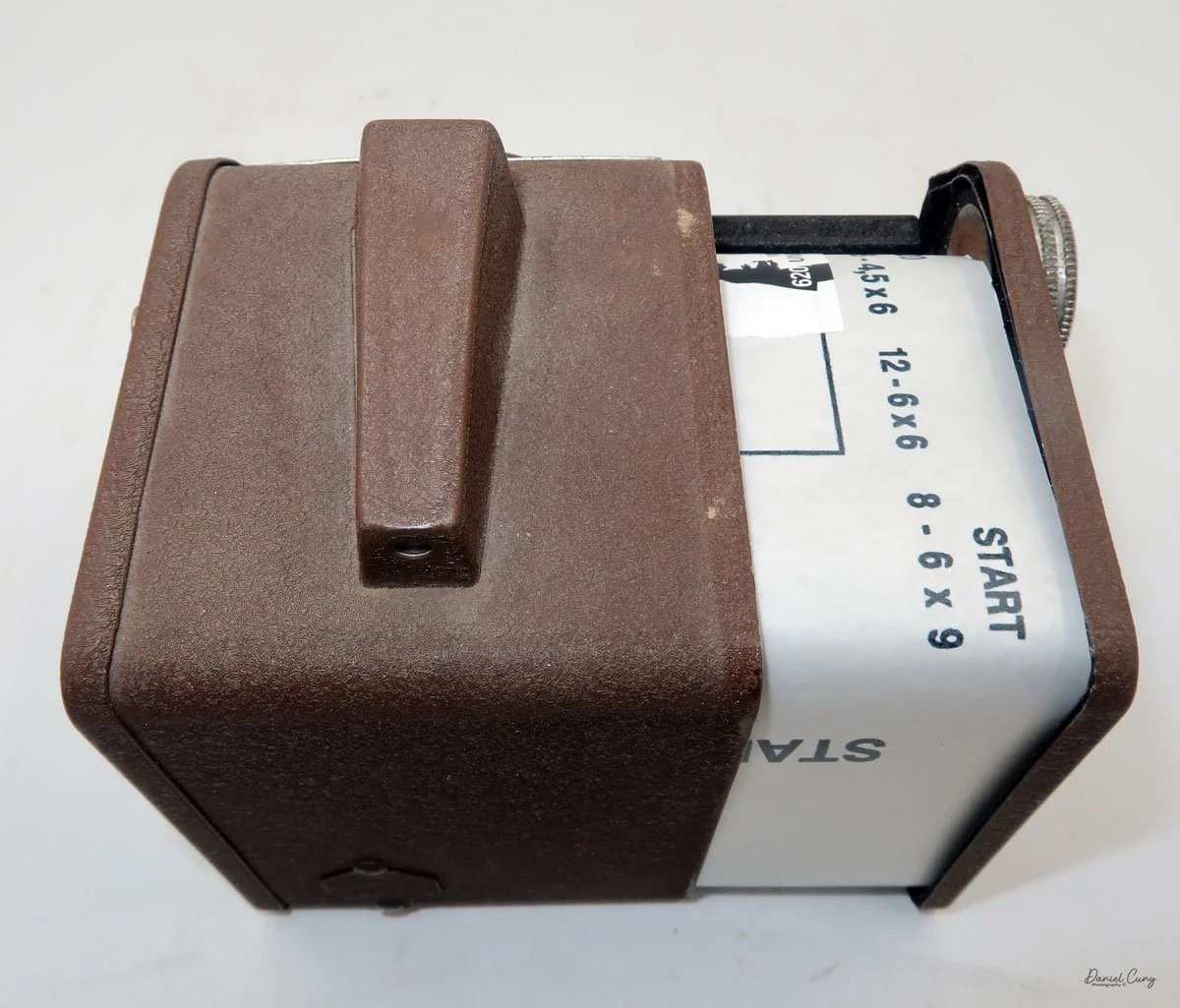 Slide film chamber back into camera body