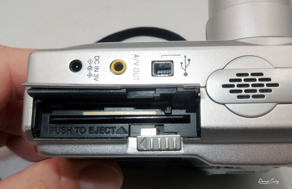 Flip latch down to open the media door