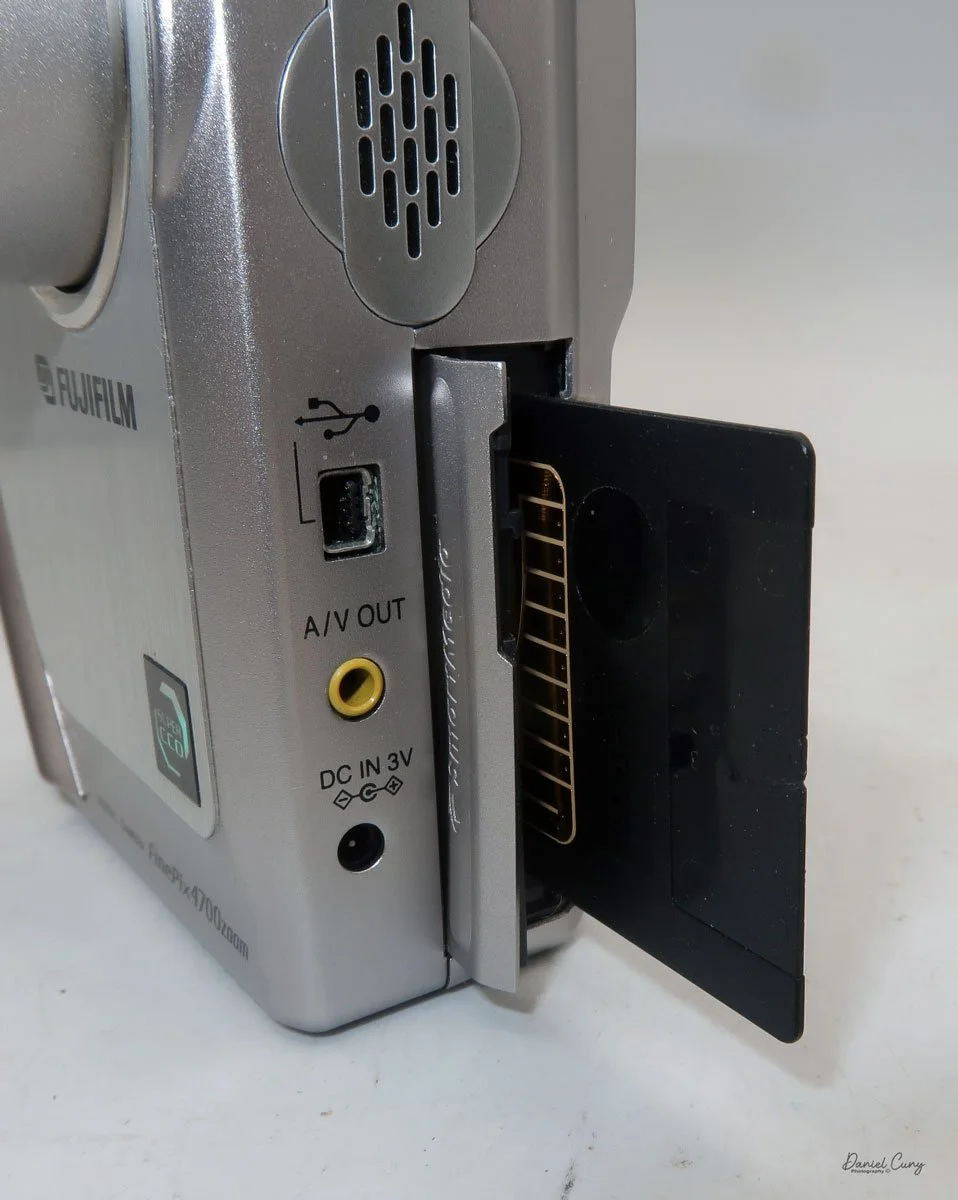 Insert Smart Media Card into the camera