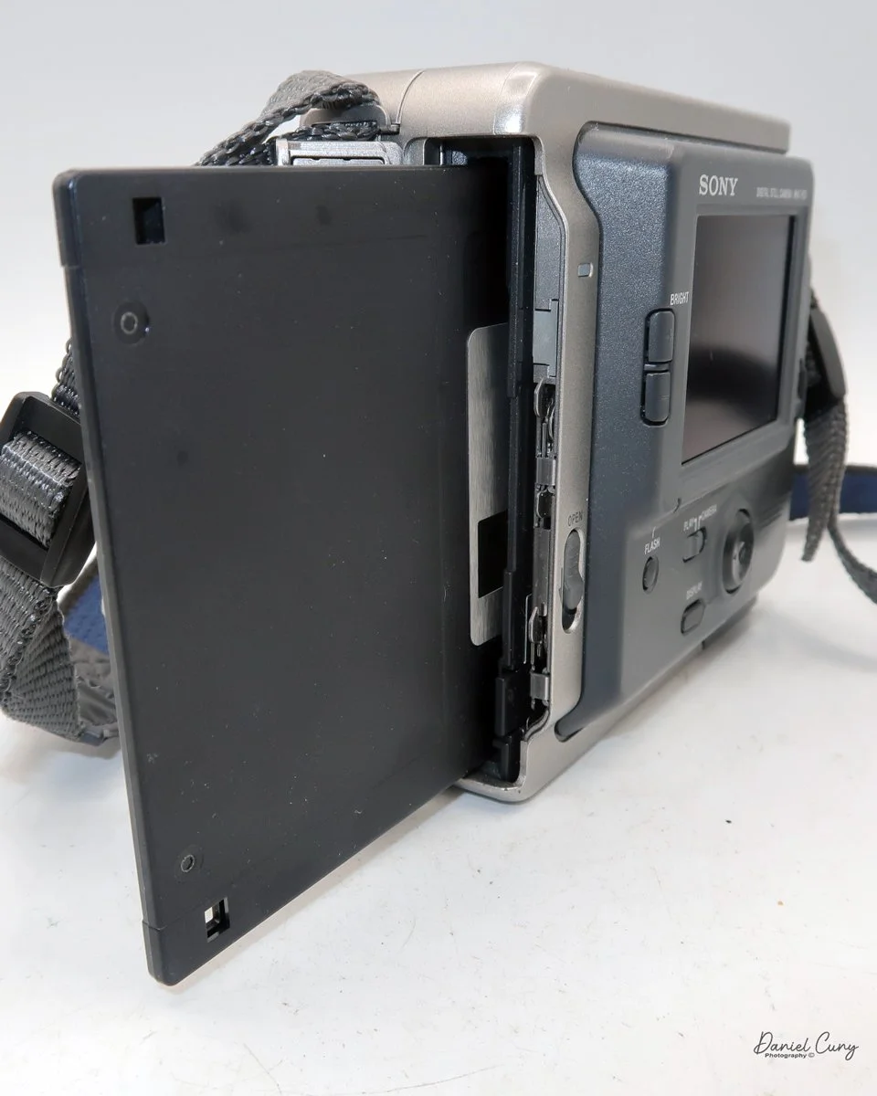 Inserting floppy disk into the camera.